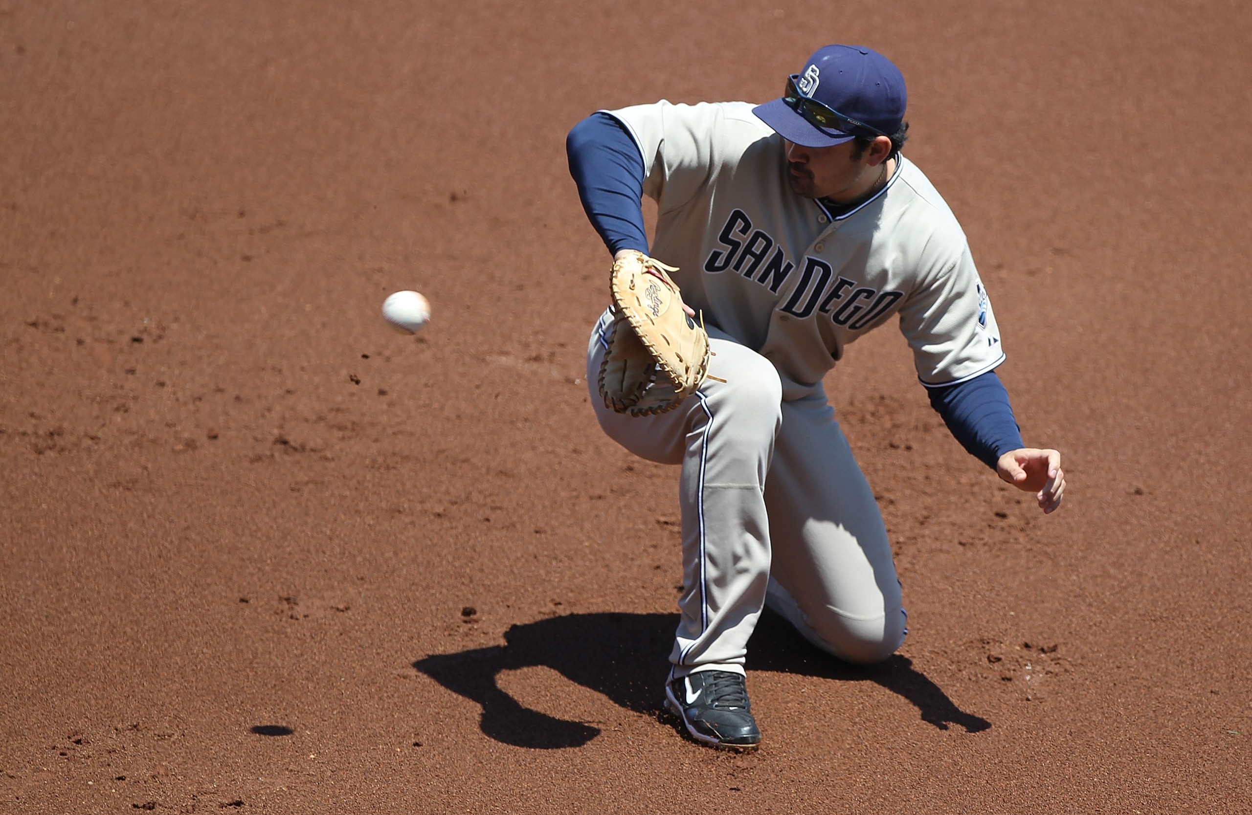 SAN FRANCISCO - MAY 13: Adrian Gonzalez #23 of the San Diego Padres fields a ball hit by Nate Scherholtz of the San Francisco Giants during an MLB game at AT&T Park on May 13, 2010 in San Francisco, California.  (Photo by Jed Jacobsohn/Getty Images)