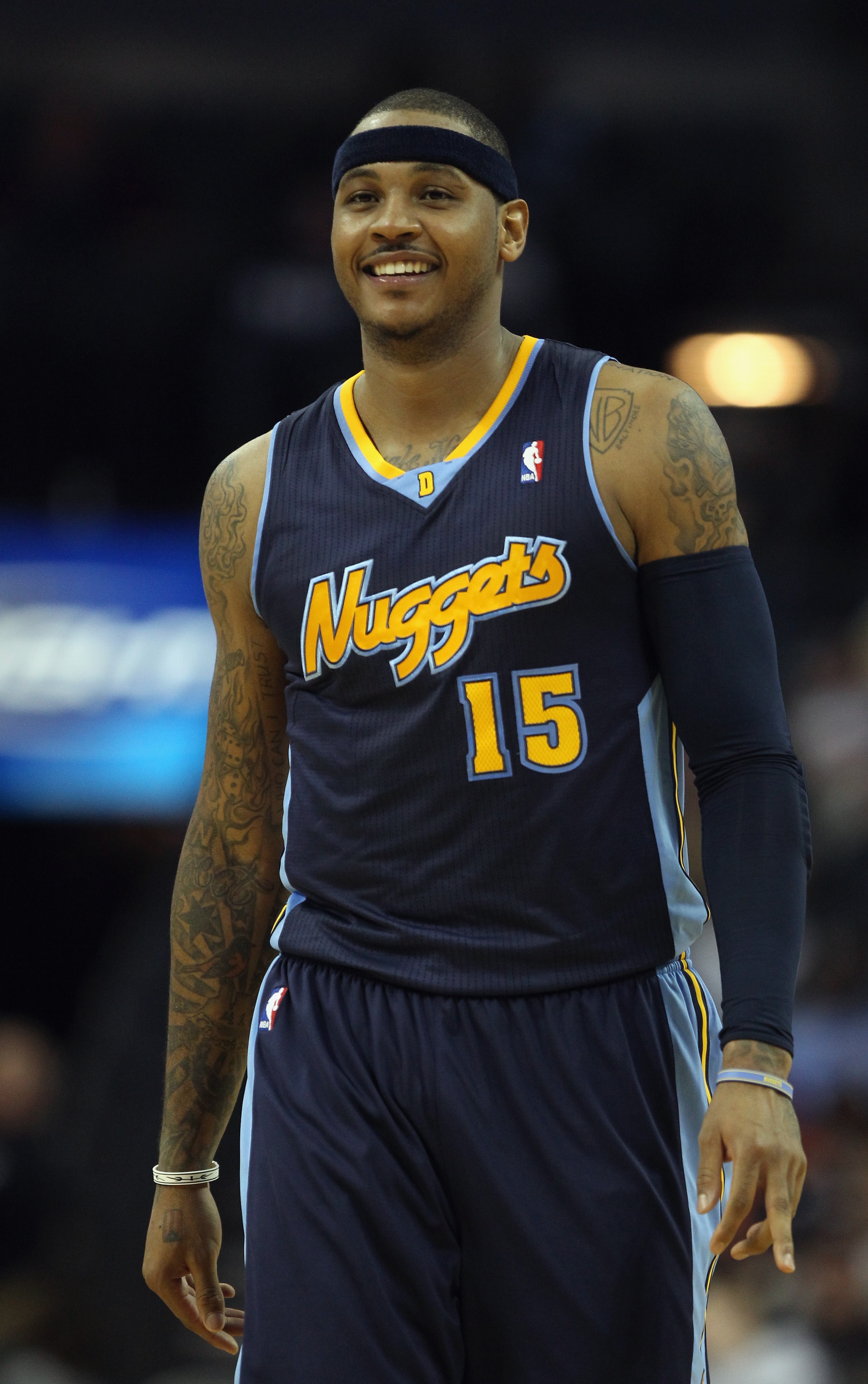CHARLOTTE, NC - DECEMBER 07:  Carmelo Anthony #15 of the Denver Nuggets watches on against the Charlotte Bobcats during their game at Time Warner Cable Arena on December 7, 2010 in Charlotte, North Carolina.  NOTE TO USER: User expressly acknowledges and