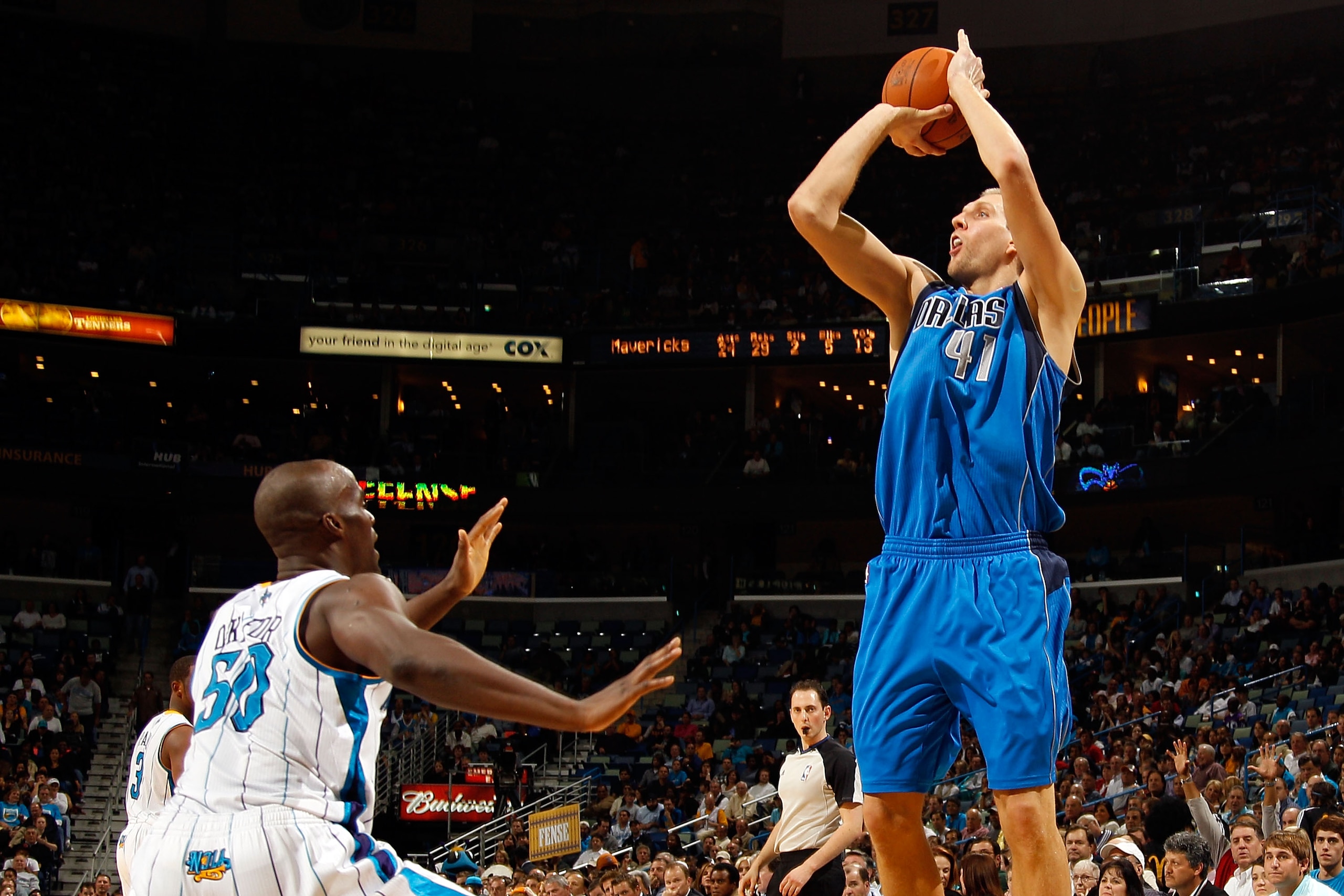 NEW ORLEANS - NOVEMBER 17:  Dirk Nowitzki #41 of the Dallas Mavericks shoots the ball over Emeka Okafor #50 of the New Orleans Hornets at the New Orleans Arena on November 17, 2010 in New Orleans, Louisiana.  The Hornets defeated the Mavericks 99-97.  NOT