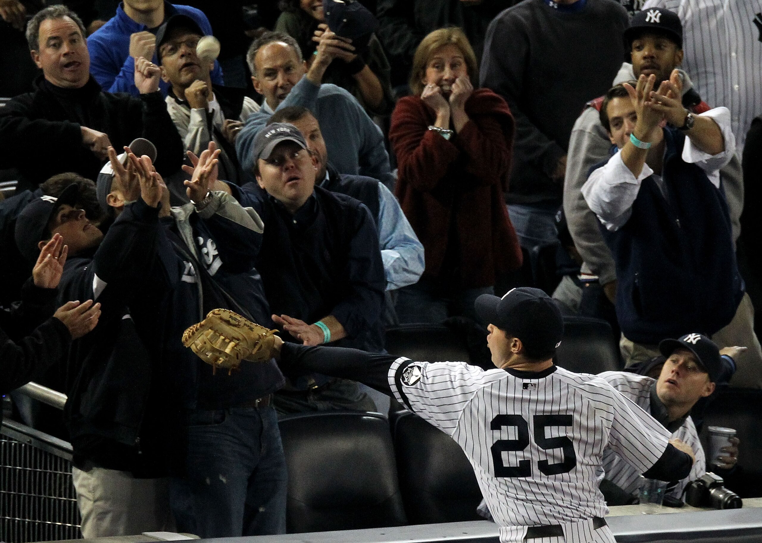 NEW YORK - OCTOBER 19:  Mark Teixeira #25 of the New York Yankees fails to make a play on a foul ball hit into the stands in the top of the fourth inning against the Texas Rangers in Game Four of the ALCS during the 2010 MLB Playoffs at Yankee Stadium on