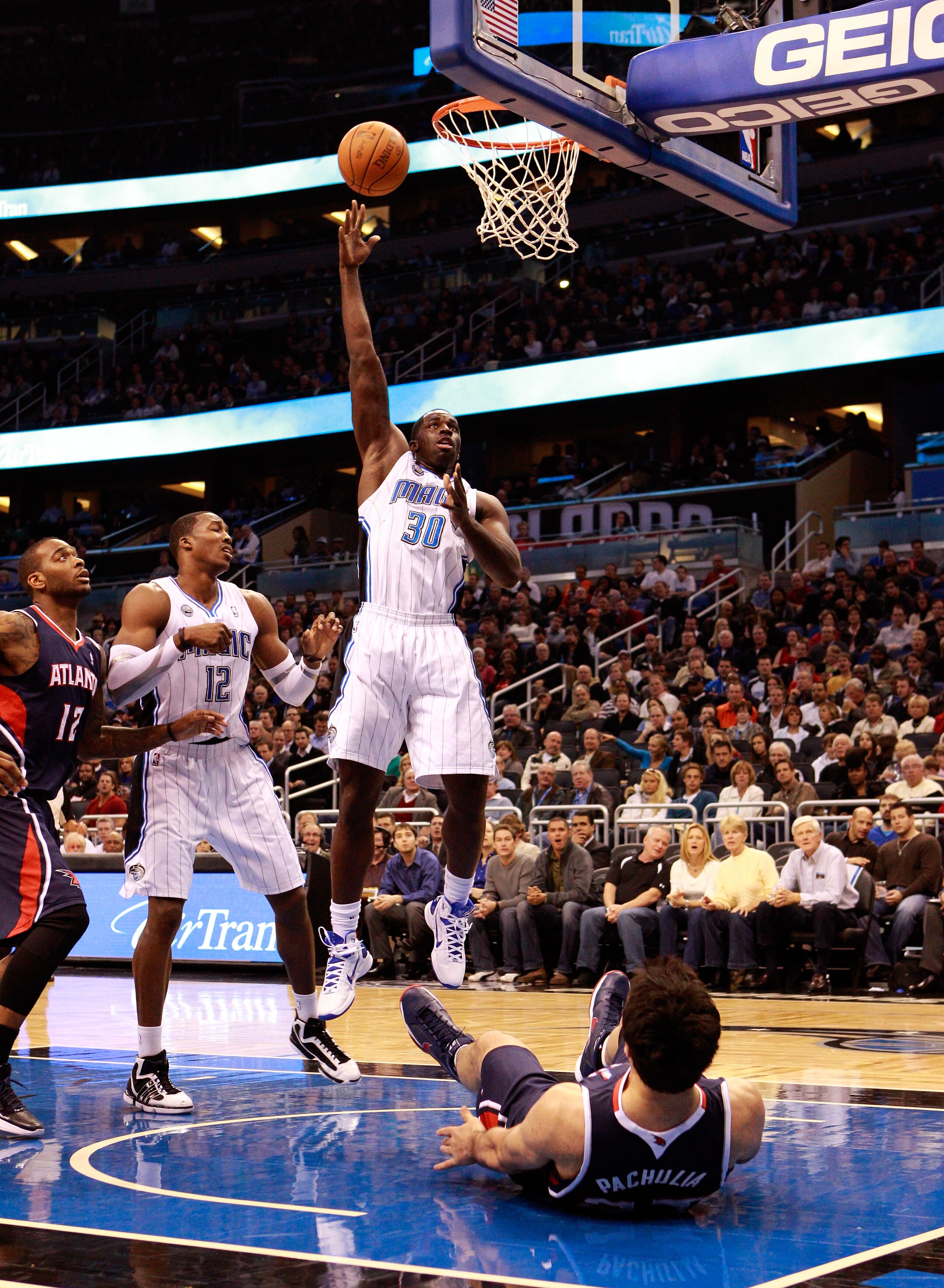 ORLANDO, FL - DECEMBER 06: Brandon Bass, #30 of the Orlando Magic, attempts a shot during the game against the Atlanta Hawks at Amway Arena on December 6, 2010 in Orlando, Florida. NOTE TO USER: User expressly acknowledges and agrees that, by downloading ORLANDO, FL - DECEMBER 06: Brandon Bass, #30 of the Orlando Magic, attempts a shot during the game against the Atlanta Hawks at Amway Arena on December 6, 2010 in Orlando, Florida. NOTE TO USER: User expressly acknowledges and agrees that, by downloading