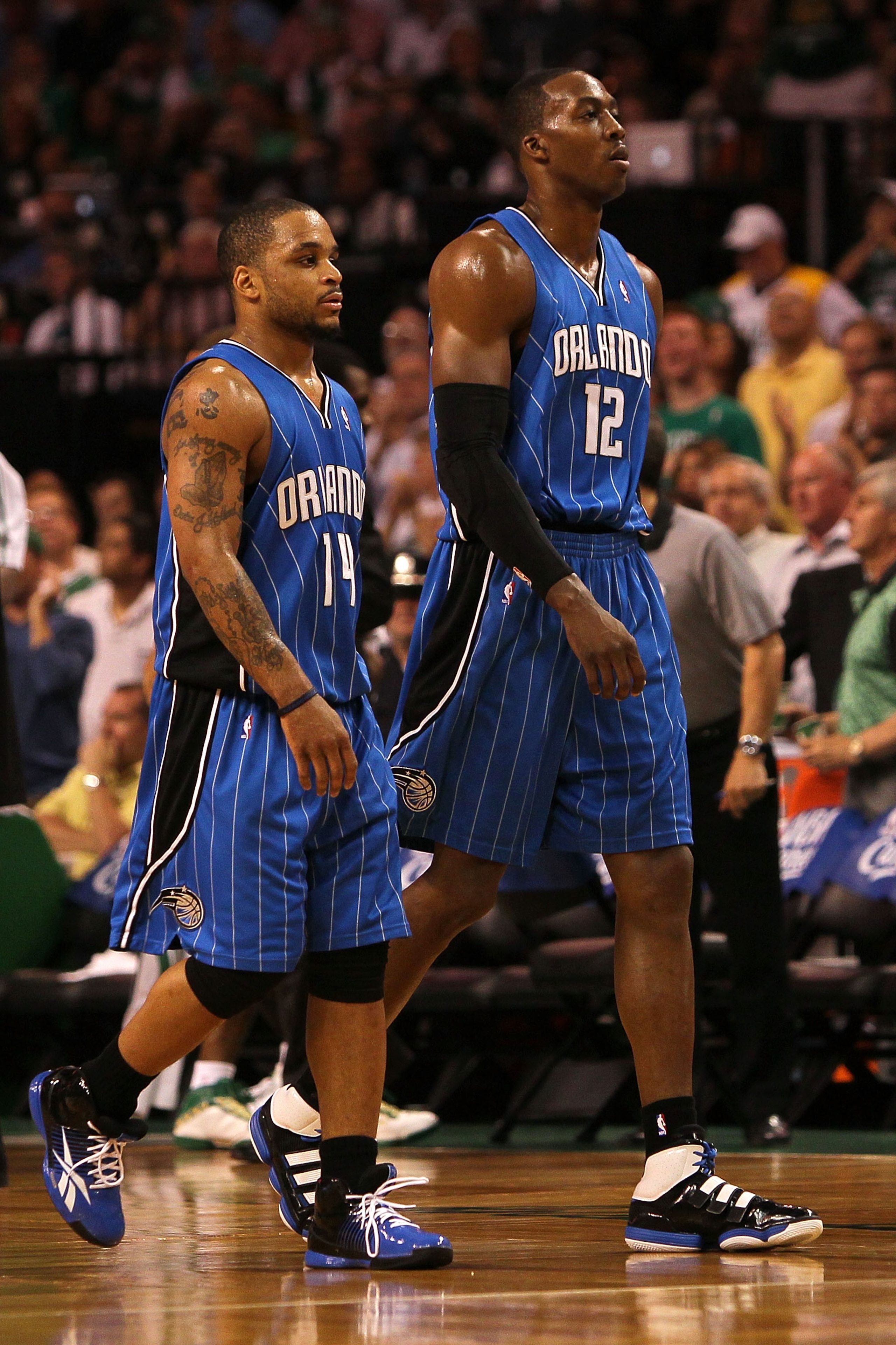 BOSTON - MAY 24: (L-R) Jameer Nelson #14 and Dwight Howard #12 of the Orlando Magic walk towards the bench against the Boston Celtics in Game Four of the Eastern Conference Finals during the 2010 NBA Playoffs at TD Banknorth Garden on May 24, 2010 in Bos BOSTON - MAY 24: (L-R) Jameer Nelson #14 and Dwight Howard #12 of the Orlando Magic walk towards the bench against the Boston Celtics in Game Four of the Eastern Conference Finals during the 2010 NBA Playoffs at TD Banknorth Garden on May 24, 2010 in Bos