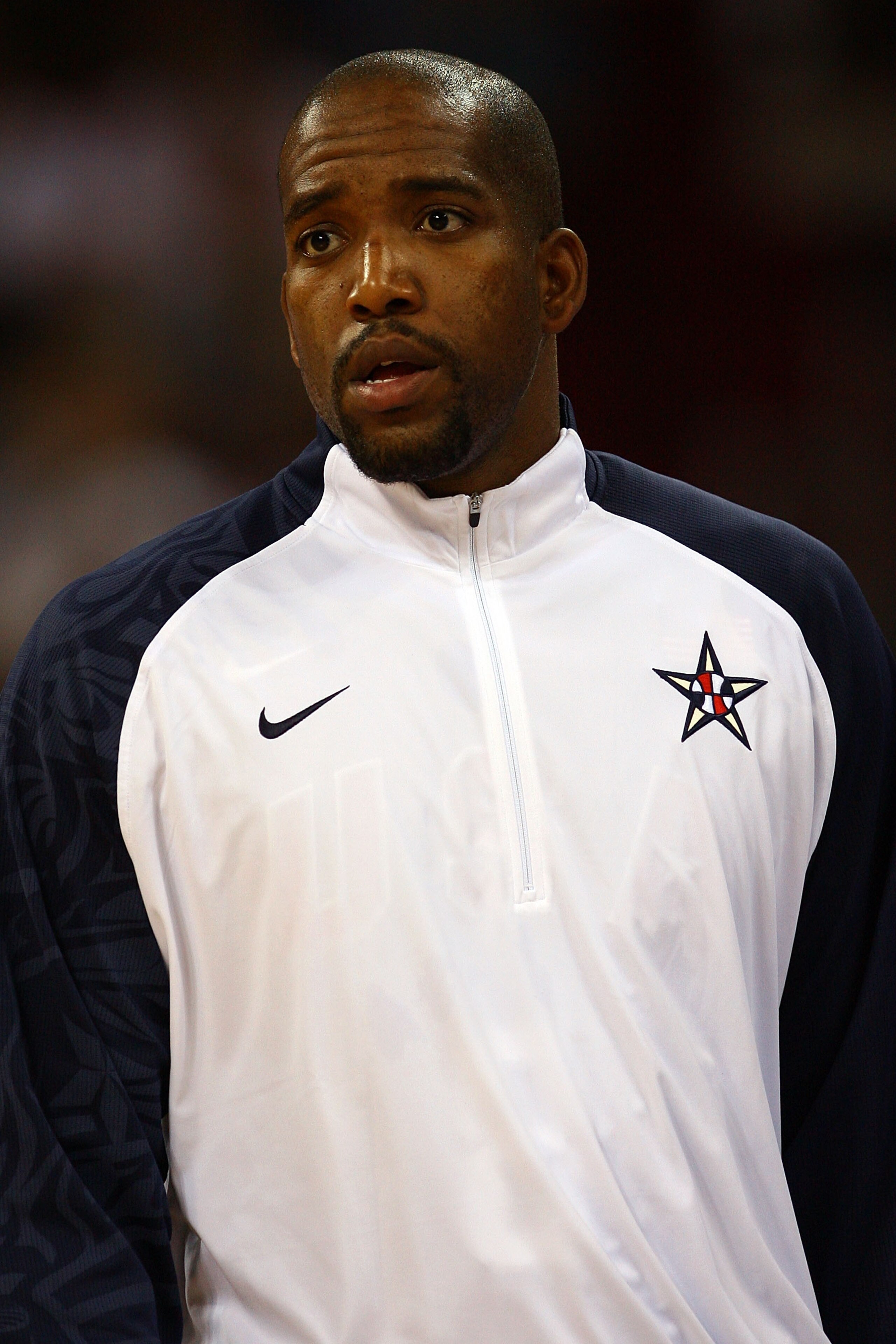 BEIJING - AUGUST 12: Michael Redd #8 of the United States looks on during the US national anthem before taking on Angola during the men's preliminary round basketball game at the Beijing Olympic Basketball Gymnasium during Day 4 of the Beijing 2008 Olymp BEIJING - AUGUST 12: Michael Redd #8 of the United States looks on during the US national anthem before taking on Angola during the men's preliminary round basketball game at the Beijing Olympic Basketball Gymnasium during Day 4 of the Beijing 2008 Olymp