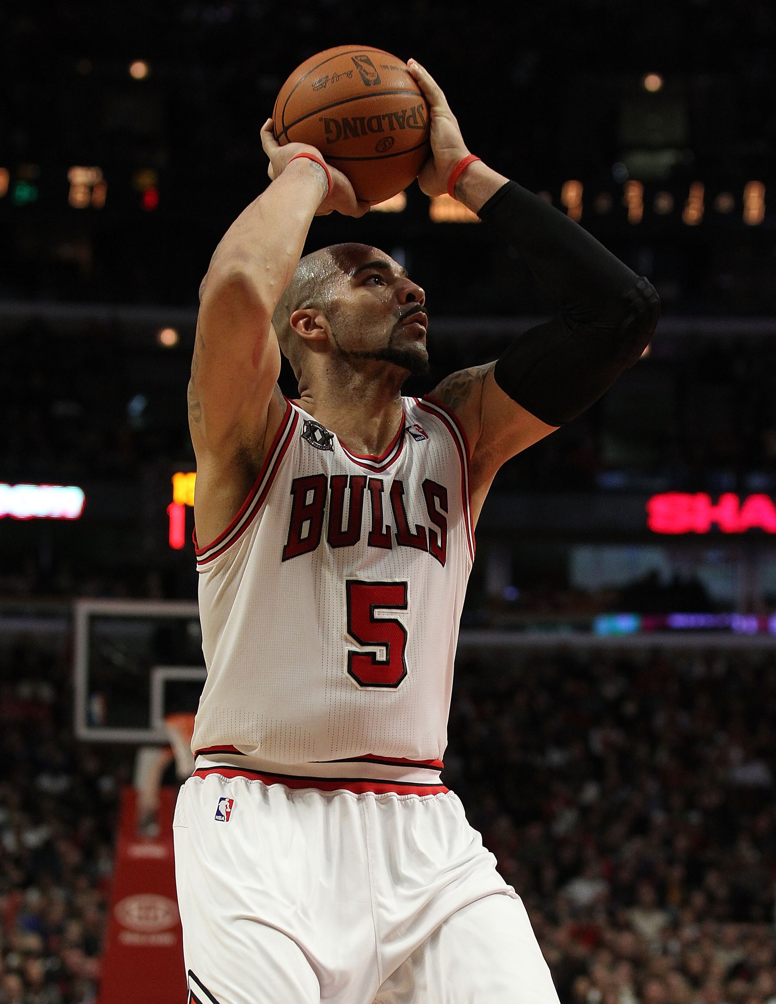 CHICAGO, IL - DECEMBER 28: Carlos Boozer #5 of the Chicago Bulls puts up a shot against the Milwaukee Bucks at the United Center on December 28, 2010 in Chicago, Illinois. The Bulls defeated the Bucks 90-77. NOTE TO USER: User expressly acknowledges and a CHICAGO, IL - DECEMBER 28: Carlos Boozer #5 of the Chicago Bulls puts up a shot against the Milwaukee Bucks at the United Center on December 28, 2010 in Chicago, Illinois. The Bulls defeated the Bucks 90-77. NOTE TO USER: User expressly acknowledges and a