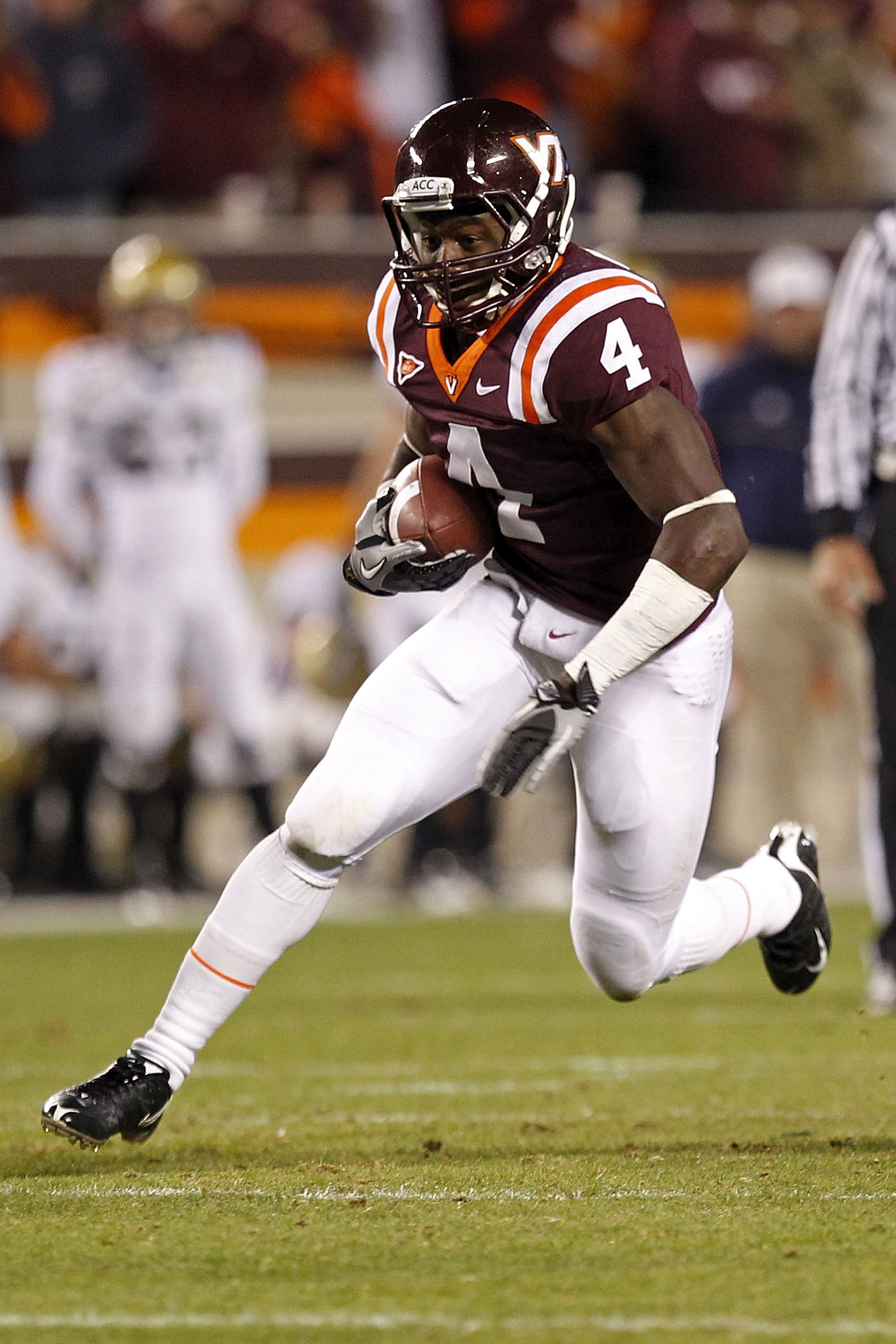 BLACKSBURG, VA - NOVEMBER 04:  Running back David Wilson #4 of the Virginia Tech Hokies runs with the ball against the Georgia Tech Yellow Jackets at Lane Stadium on November 4, 2010 in Blacksburg, Virginia.  (Photo by Geoff Burke/Getty Images)