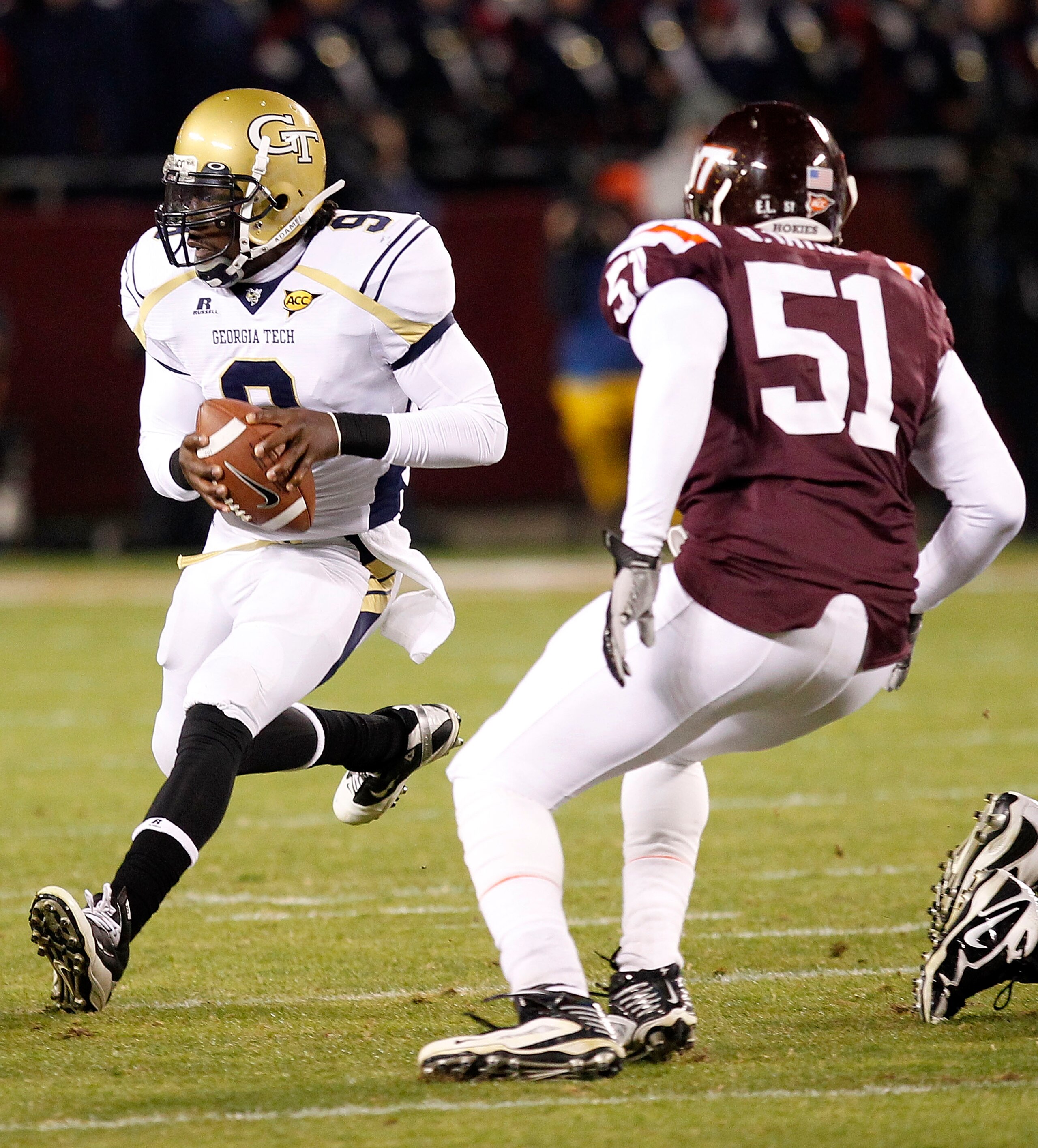 BLACKSBURG, VA - NOVEMBER 04: Quarterback Joshua Nesbitt #9 of the Georgia Tech Yellow Jackets runs with the ball as linebacker Bruce Taylor #51 of the Virginia Tech Hokies chases at Lane Stadium on November 4, 2010 in Blacksburg, Virginia. (Photo by Geo BLACKSBURG, VA - NOVEMBER 04: Quarterback Joshua Nesbitt #9 of the Georgia Tech Yellow Jackets runs with the ball as linebacker Bruce Taylor #51 of the Virginia Tech Hokies chases at Lane Stadium on November 4, 2010 in Blacksburg, Virginia. (Photo by Geo