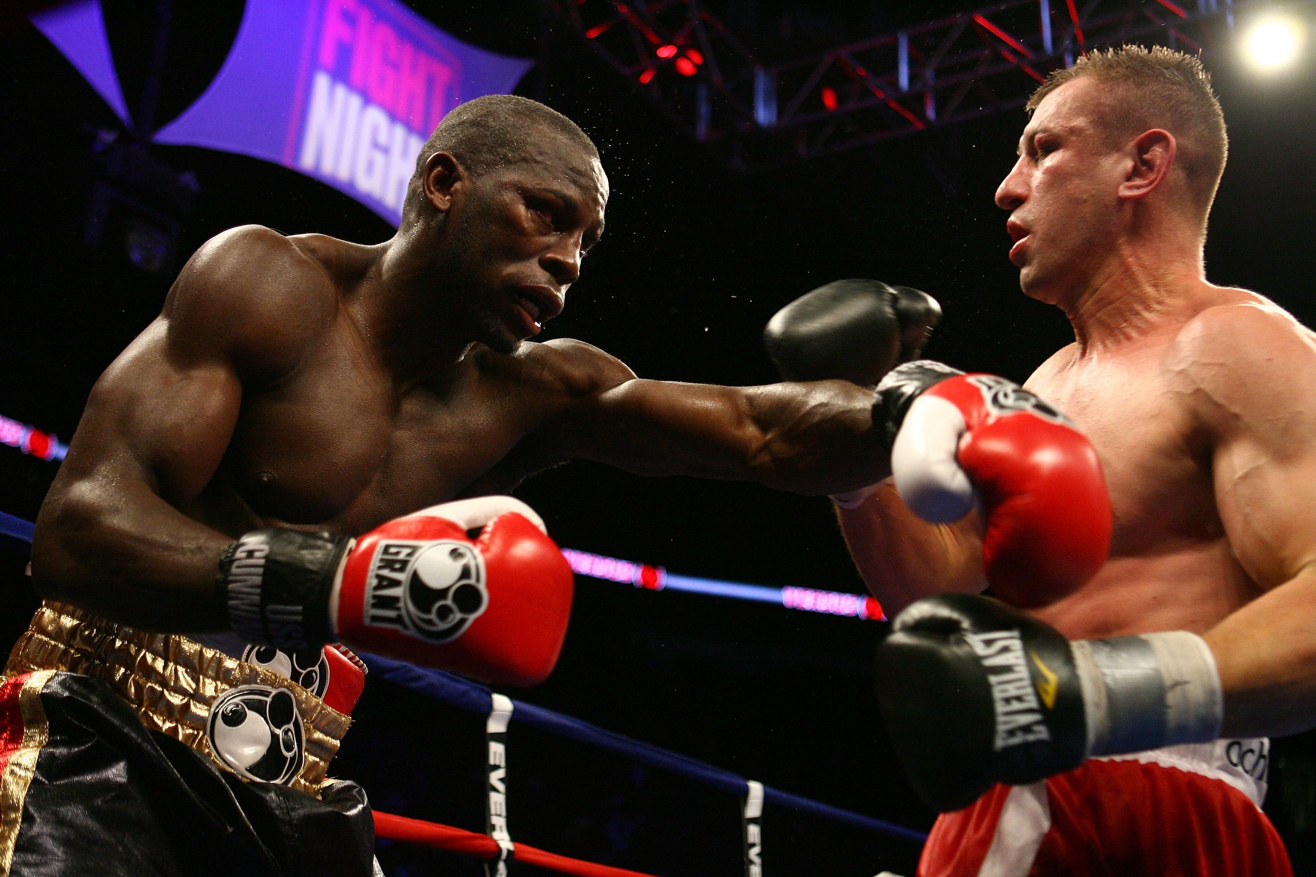 NEWARK, NJ - DECEMBER 11:  Steve Cunningham punches Tomasz Adamek during their IBF Cruiserweight Championship fight on December 11, 2008 at The Prudential Center in Newark, New Jersey.  Tomasz won a split decision.  (Photo by Al Bello/Getty Images)