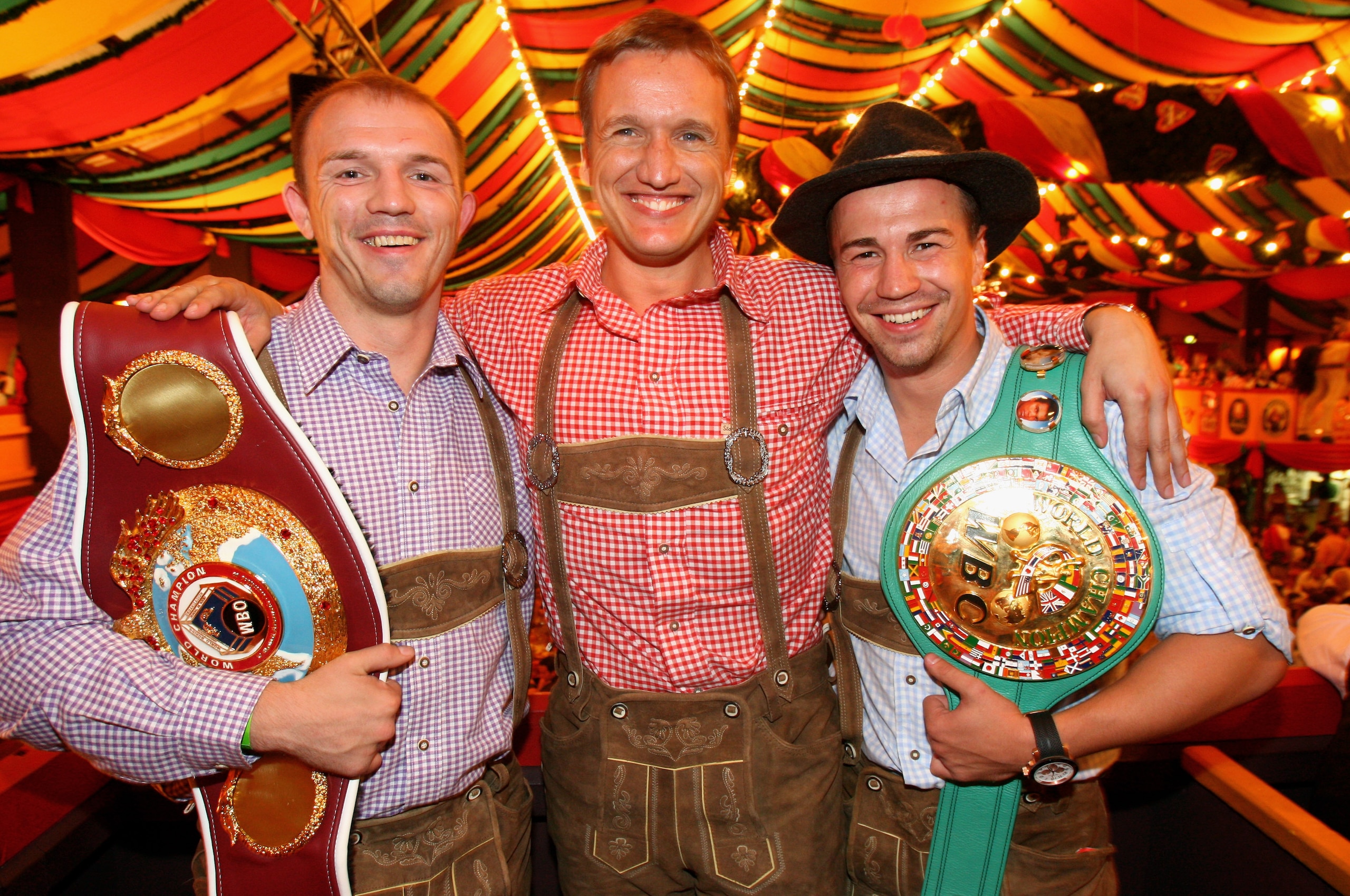 MUNICH, GERMANY - SEPTEMBER 30:  (L-R) Juergen Braehmer, WBO Inter-Continental super middleweight champion,  Dietmar Poszwa of Universum Box-Promotion and WBC Interim Middleweight World Championship Sebastian Zbik pose for a picture at the Hippodrom beer