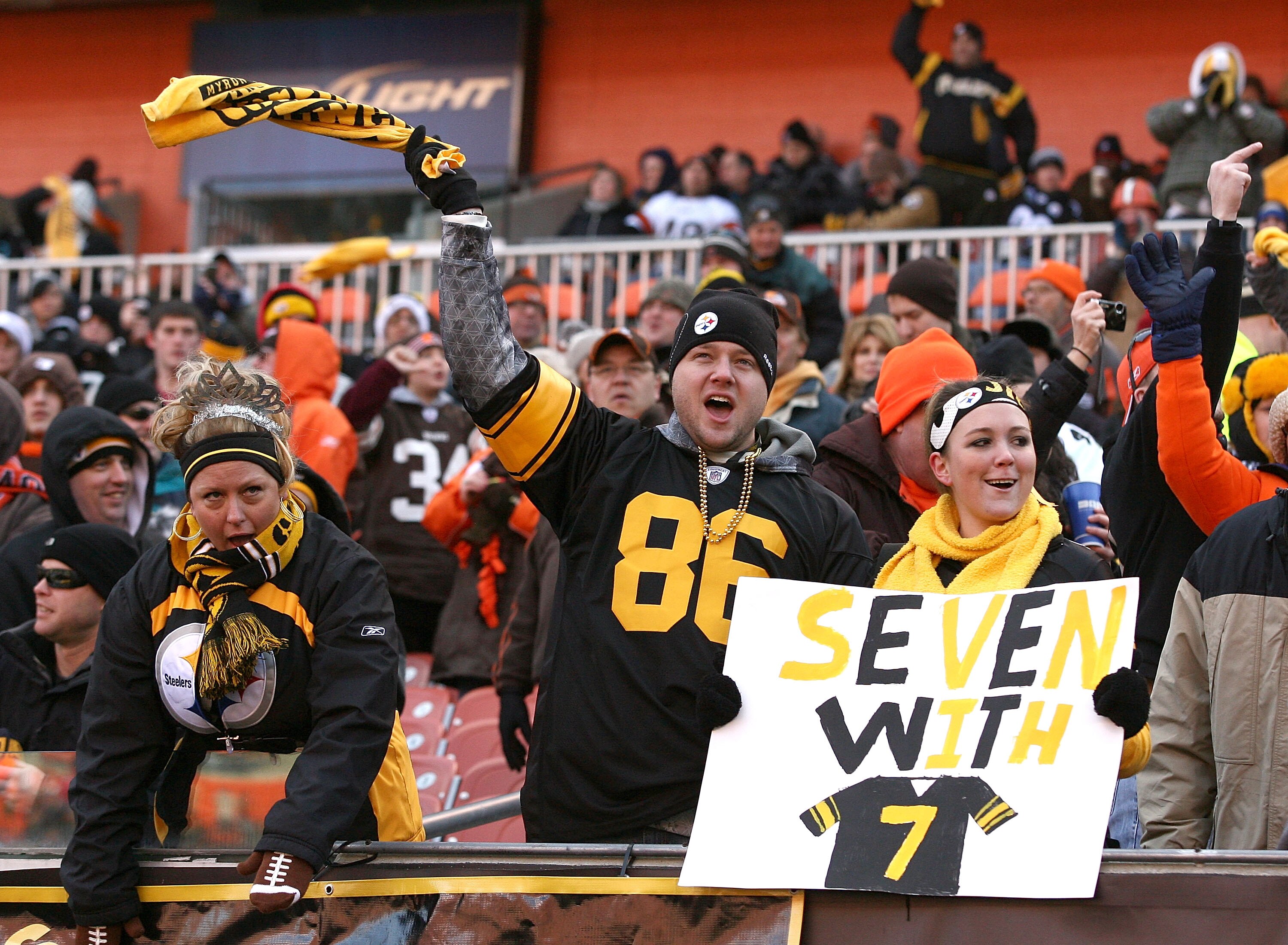 CLEVELAND, OH - JANUARY 02:  Fans of the Pittsburgh Steelers celebrate during their game against the Cleveland Browns at Cleveland Browns Stadium on January 2, 2011 in Cleveland, Ohio.  (Photo by Matt Sullivan/Getty Images)