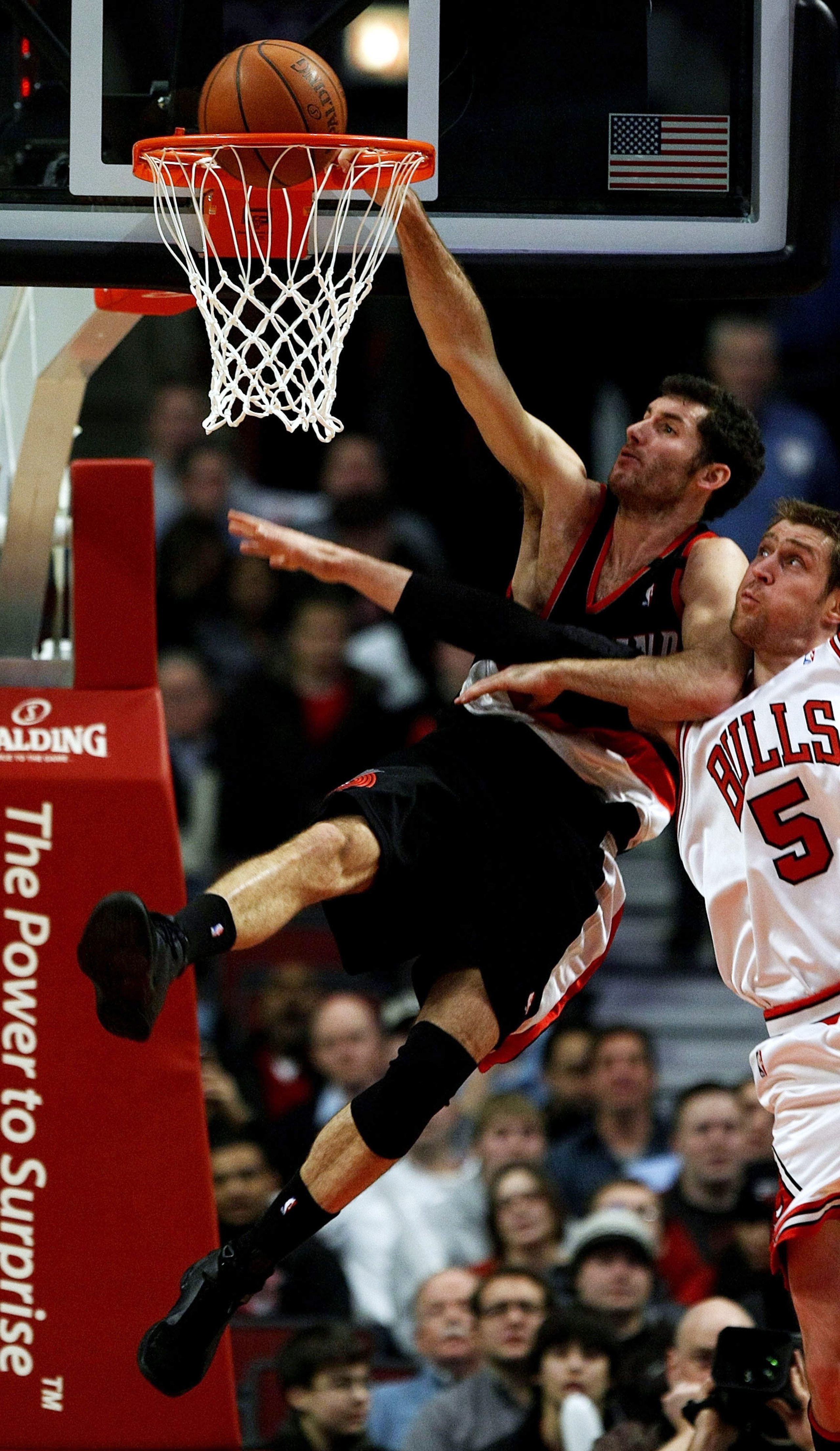 CHICAGO - JANUARY 12: Rudy Fernandez #5 of the Portland Trail Blazers dunks the ball against Andres Nocioni #5 of the Chicago Bulls on January 12, 2009 at the United Center in Chicago, Illinois.The trail Blazers defeated the Bulls 109-95. NOTE TO USER: Us