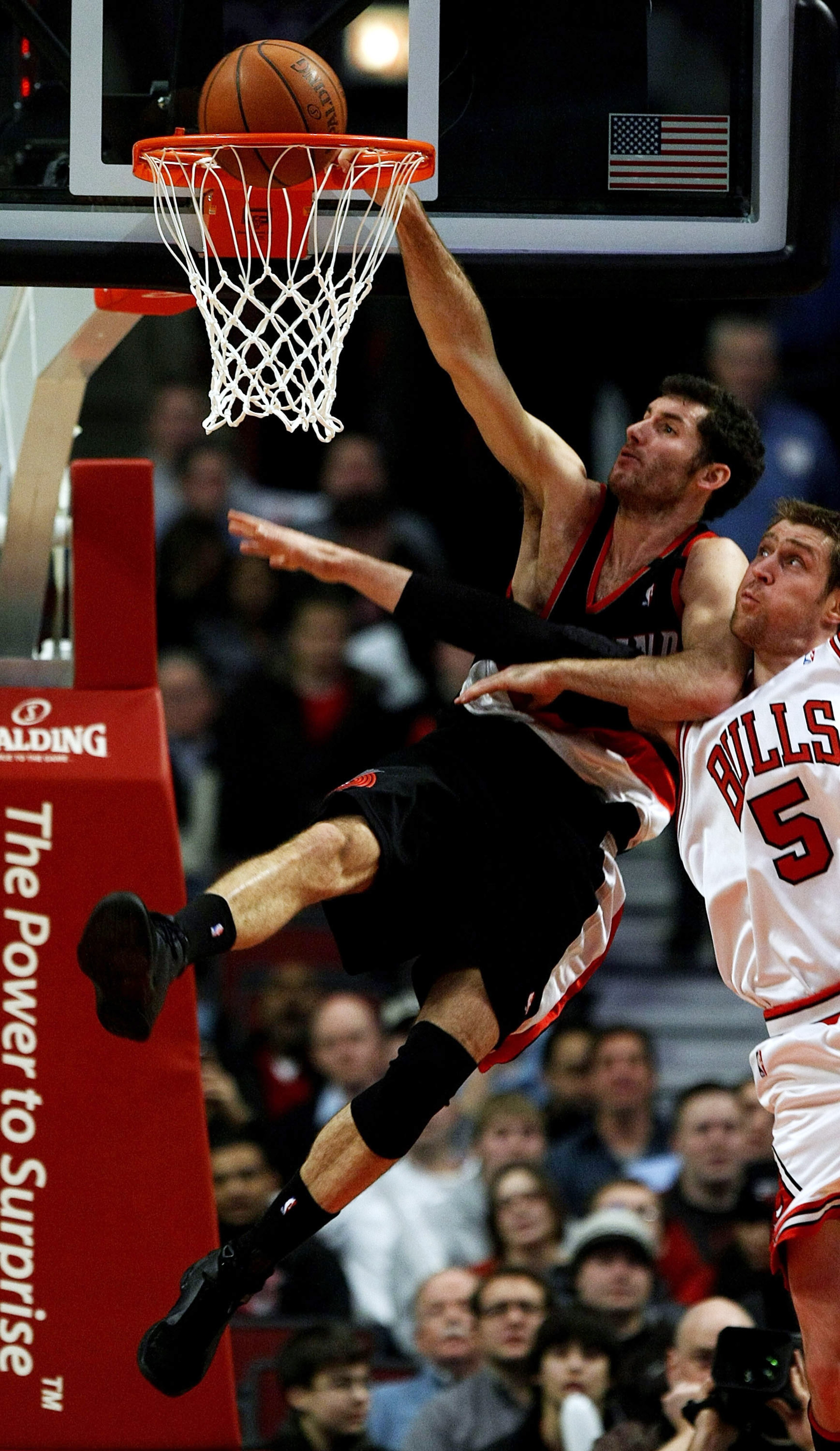 CHICAGO - JANUARY 12: Rudy Fernandez #5 of the Portland Trail Blazers dunks the ball against Andres Nocioni #5 of the Chicago Bulls on January 12, 2009 at the United Center in Chicago, Illinois.The trail Blazers defeated the Bulls 109-95. NOTE TO USER: Us