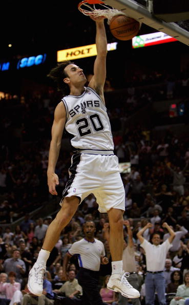 SAN ANTONIO, TX - MAY 28:  Manu Ginobili #20 of the San Antonio Spurs slam dunks against the Phoenix Suns in Game three of the Western Conference Finals during the 2005 NBA Playoffs at SBC Center on May 28, 2005 in San Antonio, Texas.  The Spurs won 102-9