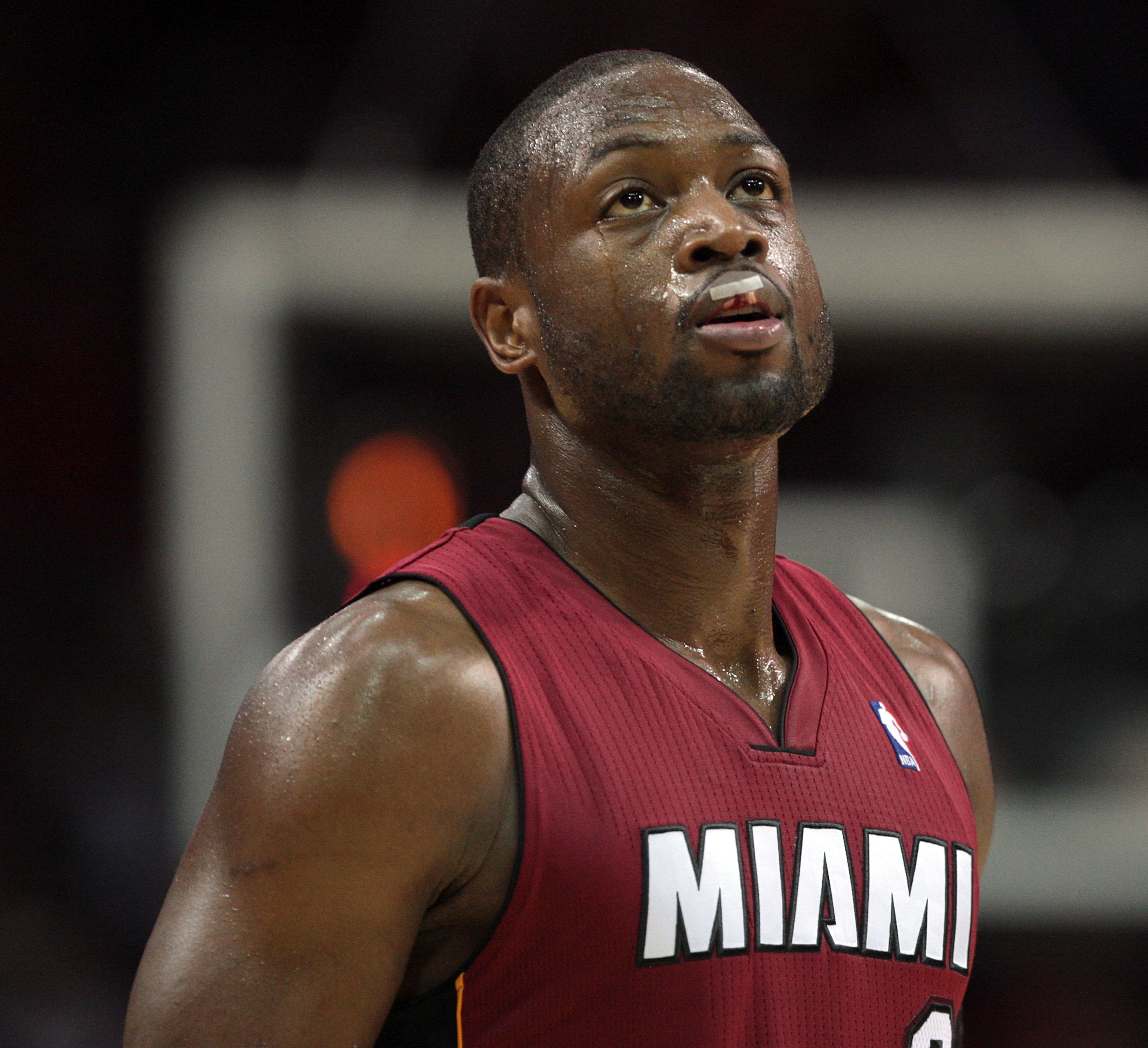 HOUSTON - DECEMBER 29:  Dwyane Wade #3 of the Miami Heat looks on in the second half after he cut his lip after being fouled by Aaron Brooks #0 of the Houston Rockets at Toyota Center on December 29, 2010 in Houston, Texas.  NOTE TO USER: User expressly a