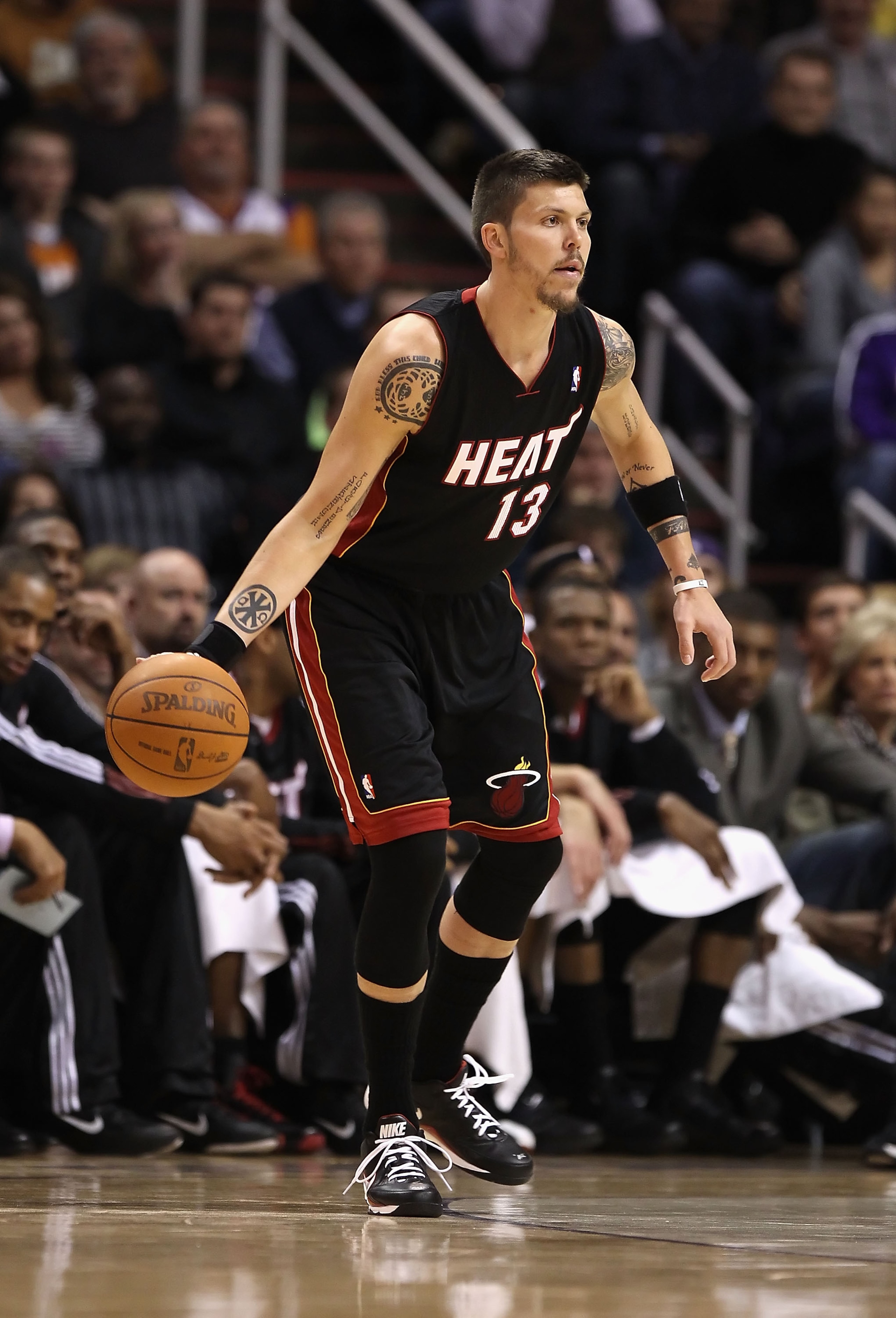 PHOENIX - DECEMBER 23:  Mike Miller #13 of the Miami Heat handles the ball during the NBA game against the Phoenix Suns at US Airways Center on December 23, 2010 in Phoenix, Arizona. NOTE TO USER: User expressly acknowledges and agrees that, by downloadin