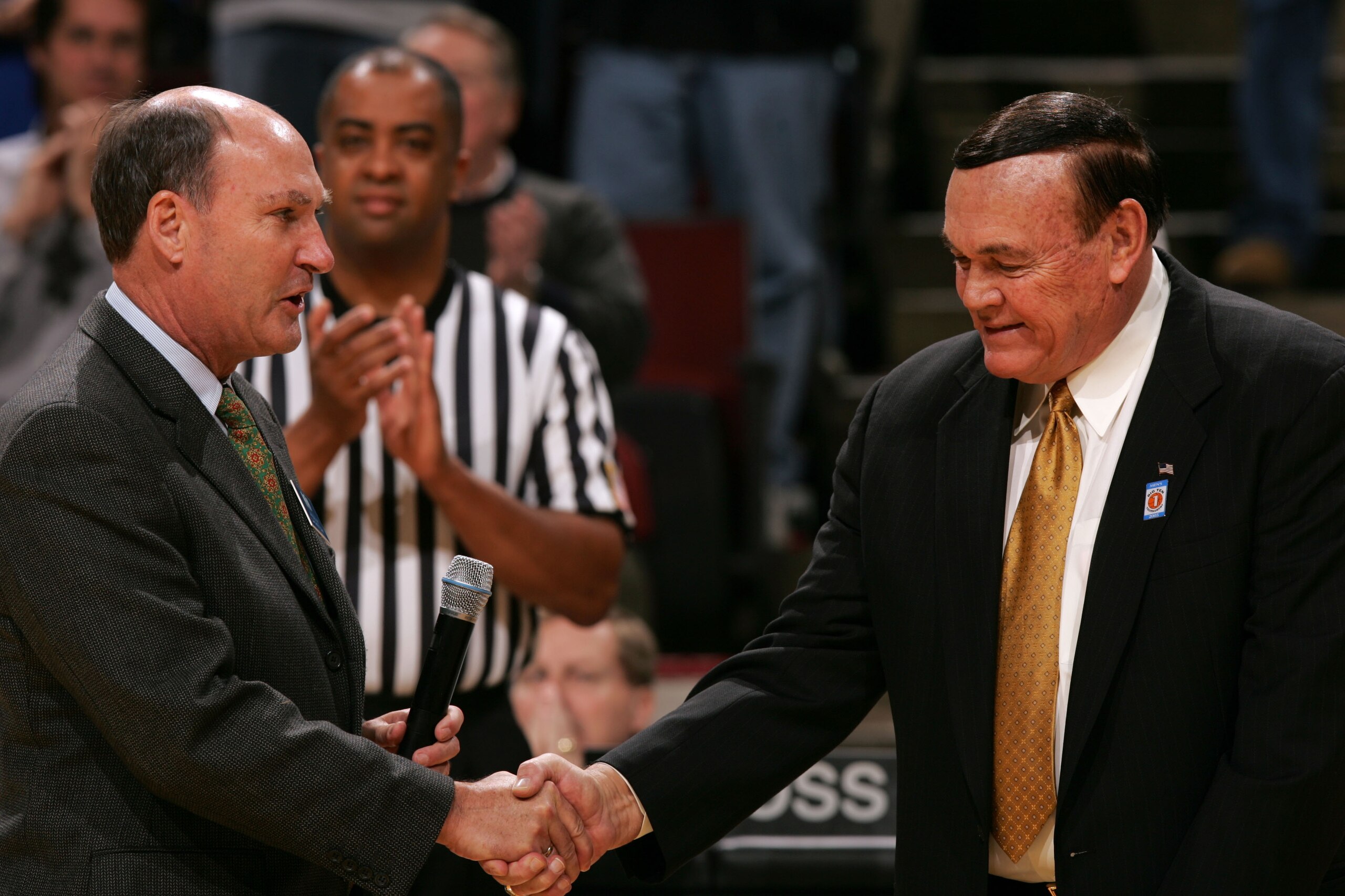 CHICAGO - MARCH 10:  Head Coach Gene Keady of the Purdue Boilermakers greets Big 10 Commissioner James E. Delany as Keady was honored prior to Purdue's game against the Iowa Hawkeyes during the first day of the Big Ten Men's Conference Basketball Tourname