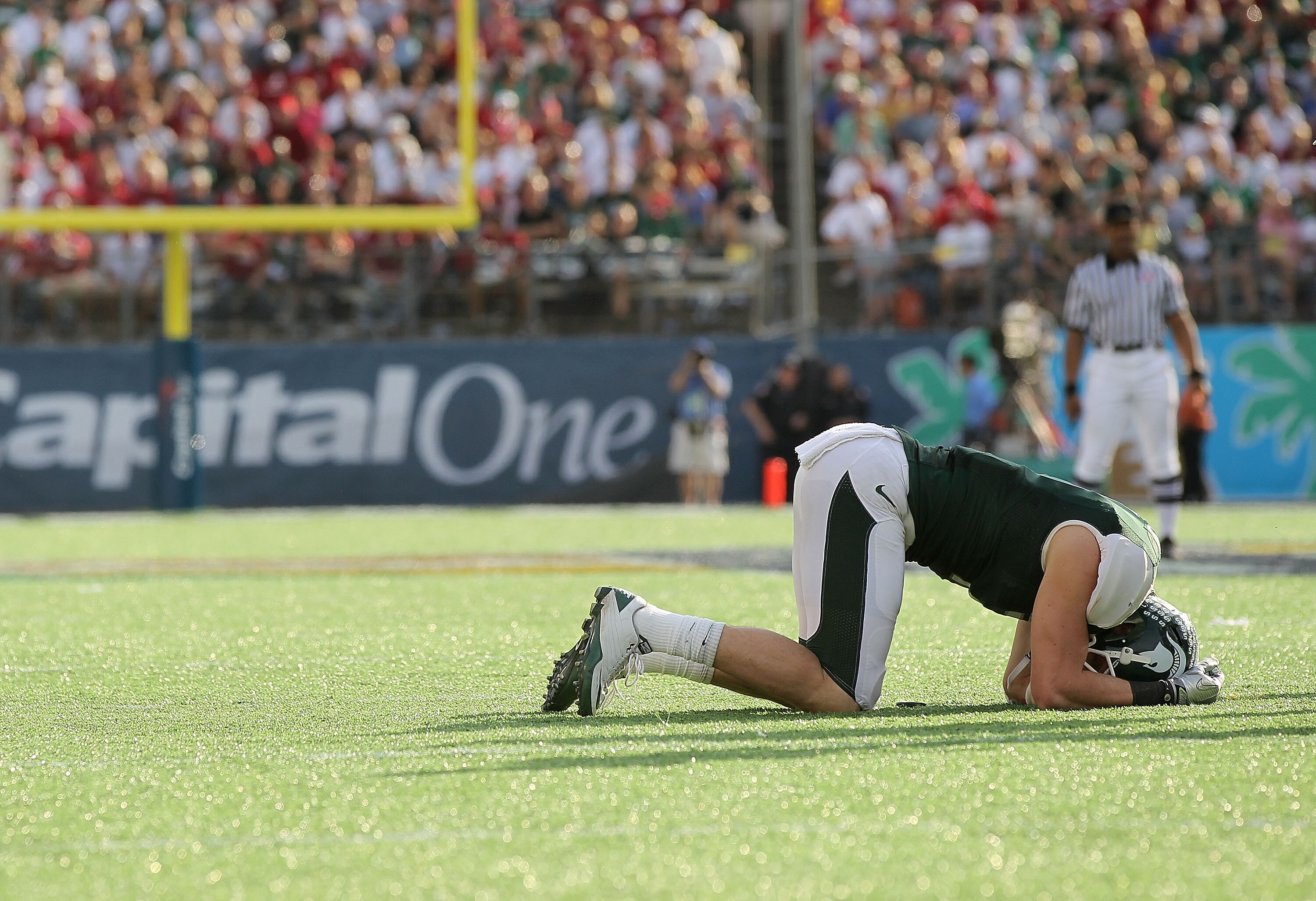 ORLANDO, FL - JANUARY 01:  Keith Nichol #7 of the Michigan State Spartans is shaken up on a play during the Capitol One Bowl against the Alabama Crimson Tide at the Florida Citrus Bowl on January 1, 2011 in Orlando, Florida.  (Photo by Mike Ehrmann/Getty 