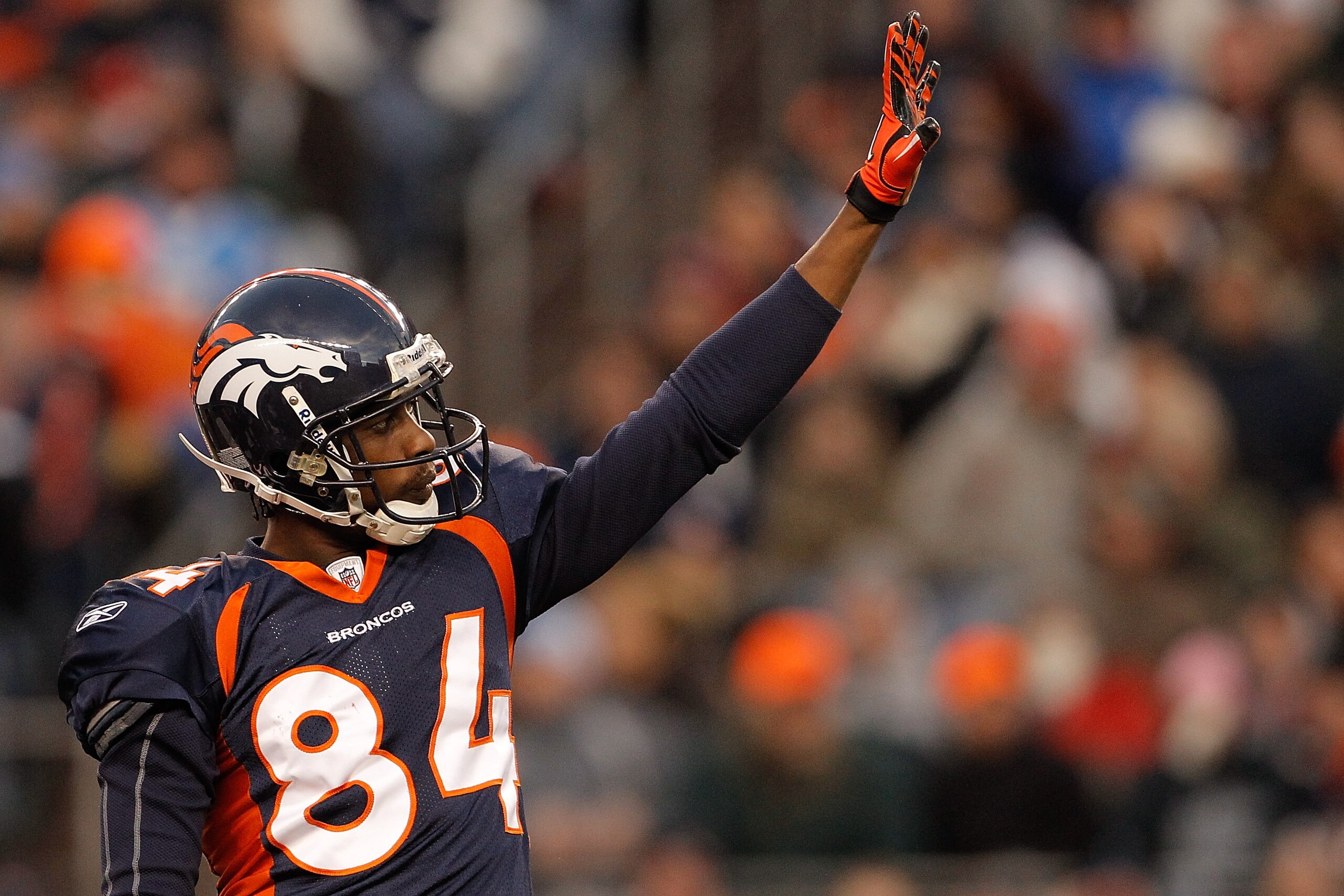 DENVER, CO - JANUARY 2:  Wide receiver Brandon Lloyd #84 of the Denver Broncos acknowledges the crowd  after an announcement to honor him for making the Pro Bowl team during a break in the action against the San Diego Chargers at INVESCO Field at Mile Hig