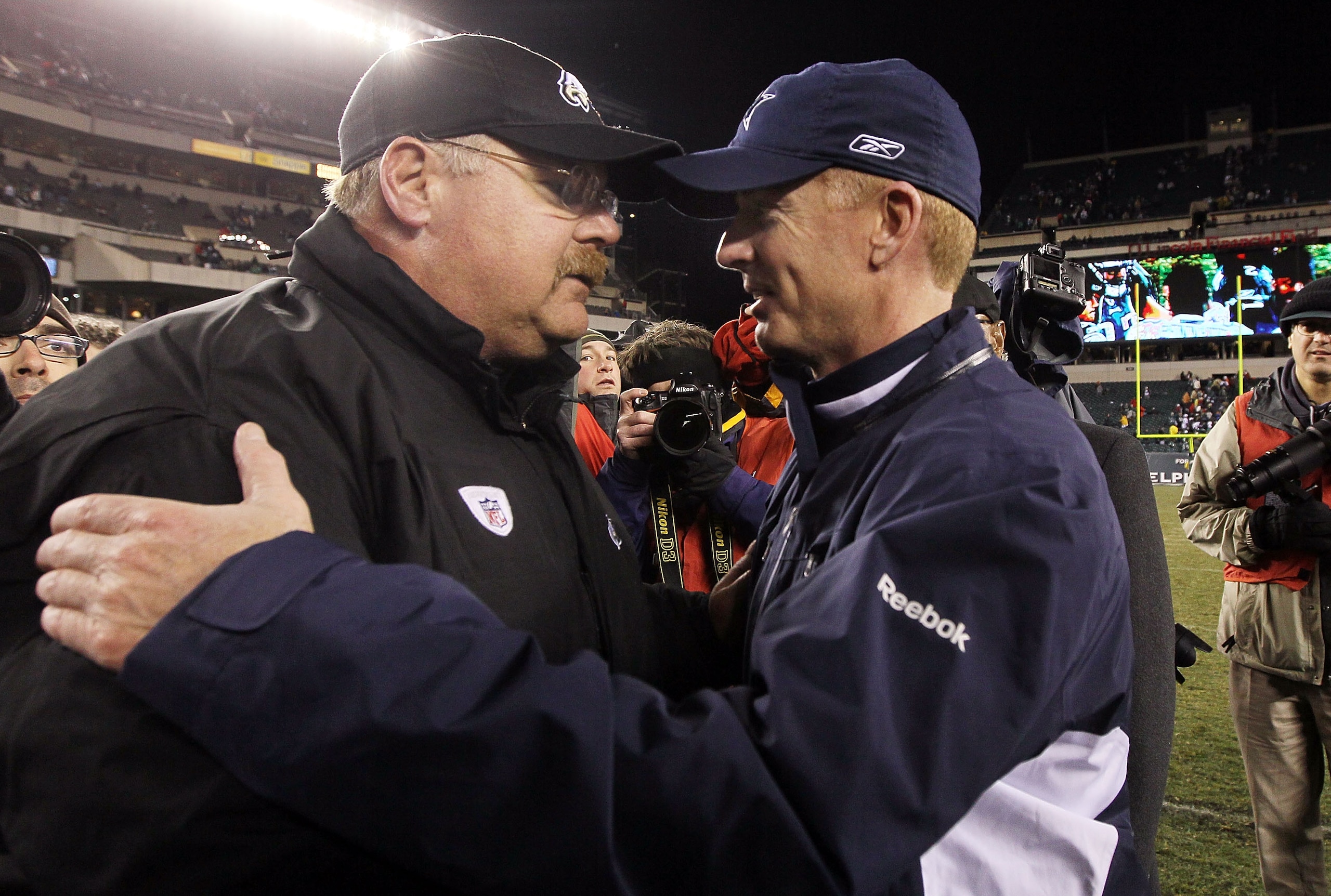 PHILADELPHIA, PA - JANUARY 02: Head coach Andy Reid of the Philadelphia Eagles meets with head coach Jason Garrett of the Dallas Cowboys after their game on January 2, 2011 at Lincoln Financial Field in Philadelphia, Pennsylvania. The Cowboys defeated the PHILADELPHIA, PA - JANUARY 02: Head coach Andy Reid of the Philadelphia Eagles meets with head coach Jason Garrett of the Dallas Cowboys after their game on January 2, 2011 at Lincoln Financial Field in Philadelphia, Pennsylvania. The Cowboys defeated the