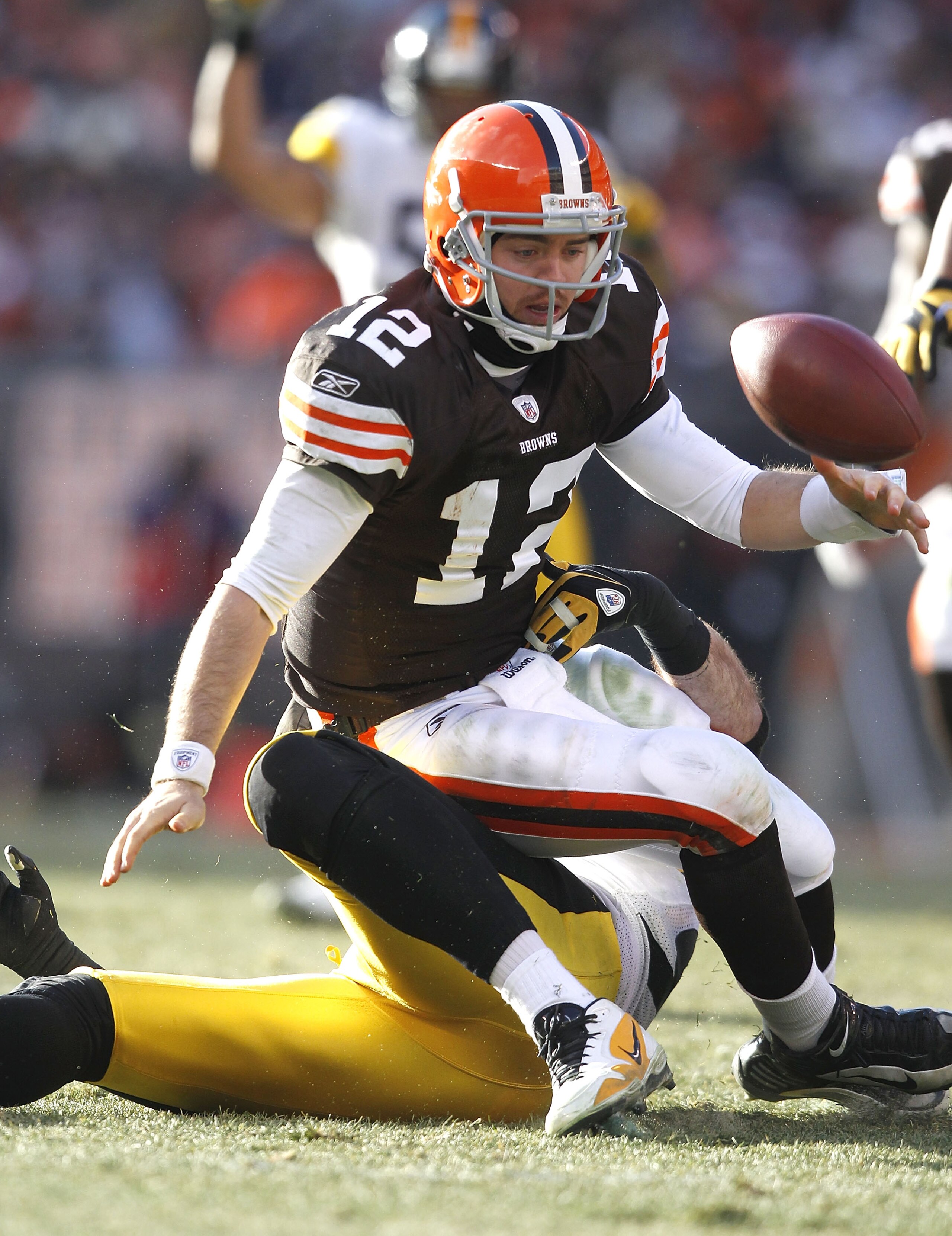 CLEVELAND, OH - JANUARY 02: Quarterback Colt McCoy #12 of the Cleveland Browns fumbles the ball after being hit by defensive end Brett Keisel #99 of the Pittsburgh Steelers at Cleveland Browns Stadium on January 2, 2011 in Cleveland, Ohio. (Photo by Mat CLEVELAND, OH - JANUARY 02: Quarterback Colt McCoy #12 of the Cleveland Browns fumbles the ball after being hit by defensive end Brett Keisel #99 of the Pittsburgh Steelers at Cleveland Browns Stadium on January 2, 2011 in Cleveland, Ohio. (Photo by Mat