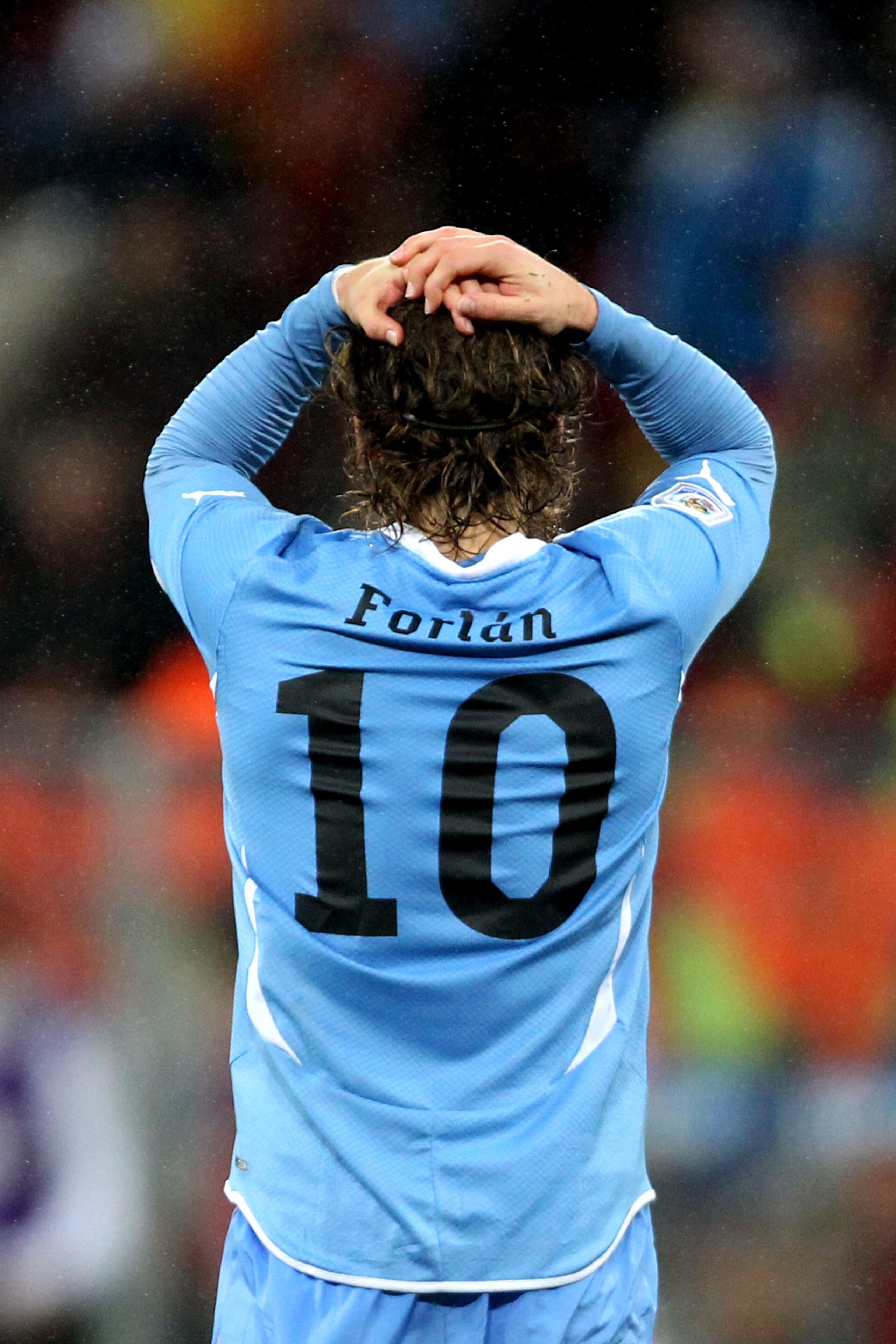 PORT ELIZABETH, SOUTH AFRICA - JULY 10: Diego Forlan of Uruguay shows his dejection after suffering defeat following the 2010 FIFA World Cup South Africa Third Place Play-off match between Uruguay and Germany at The Nelson Mandela Bay Stadium on July 10,