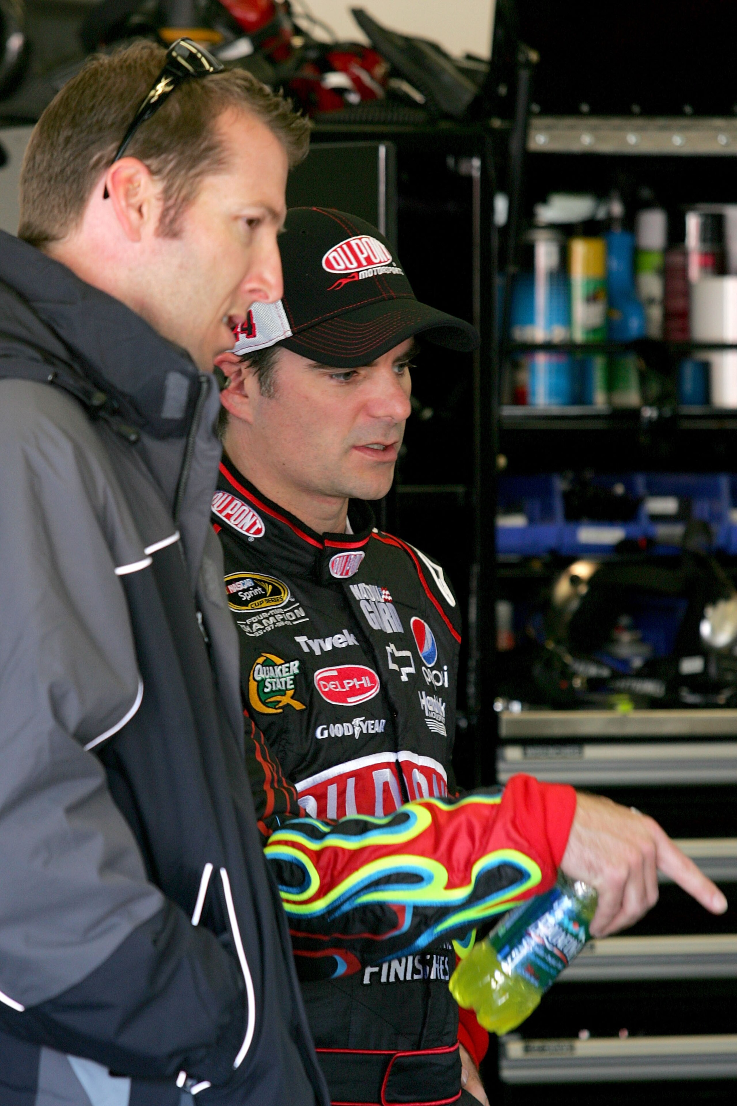 DAYTONA BEACH, FL - FEBRUARY 10: Alan Gustafson (L), crew chief for Mark Martin (not pictured), driver of the #5 GoDaddy.com Chevrolet, and Jeff Gordon, driver of the #24 DuPont Chevrolet, talk in the garage during practice for the NASCAR Sprint Cup Seri DAYTONA BEACH, FL - FEBRUARY 10: Alan Gustafson (L), crew chief for Mark Martin (not pictured), driver of the #5 GoDaddy.com Chevrolet, and Jeff Gordon, driver of the #24 DuPont Chevrolet, talk in the garage during practice for the NASCAR Sprint Cup Seri