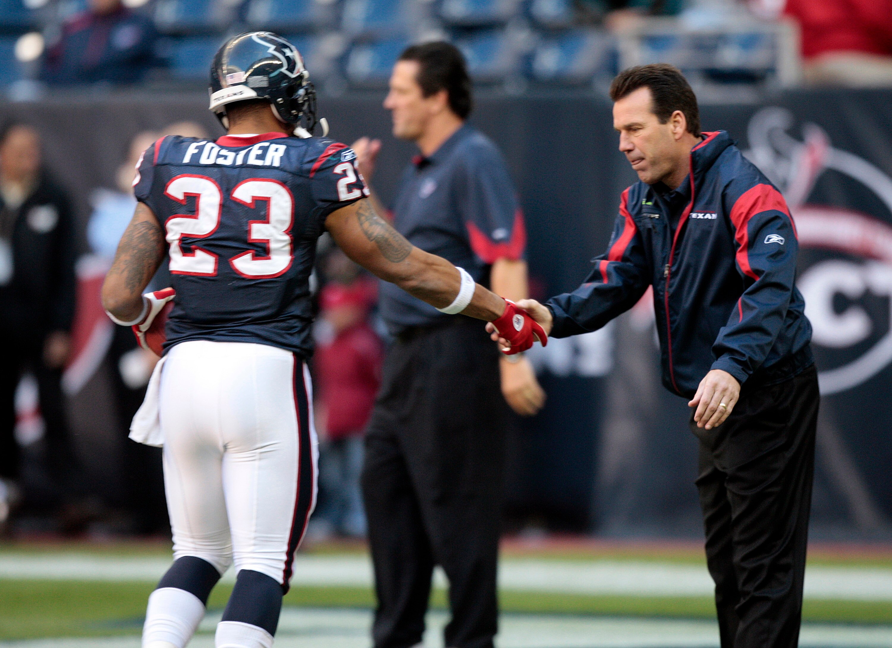 HOUSTON, TX - JANUARY 02:  Head coach Gary Kubiak of the Houston Texans greets running back Arian Foster #23 before playing the Jacksonville Jaguars at Reliant Stadium on January 2, 2011 in Houston, Texas.  (Photo by Bob Levey/Getty Images)