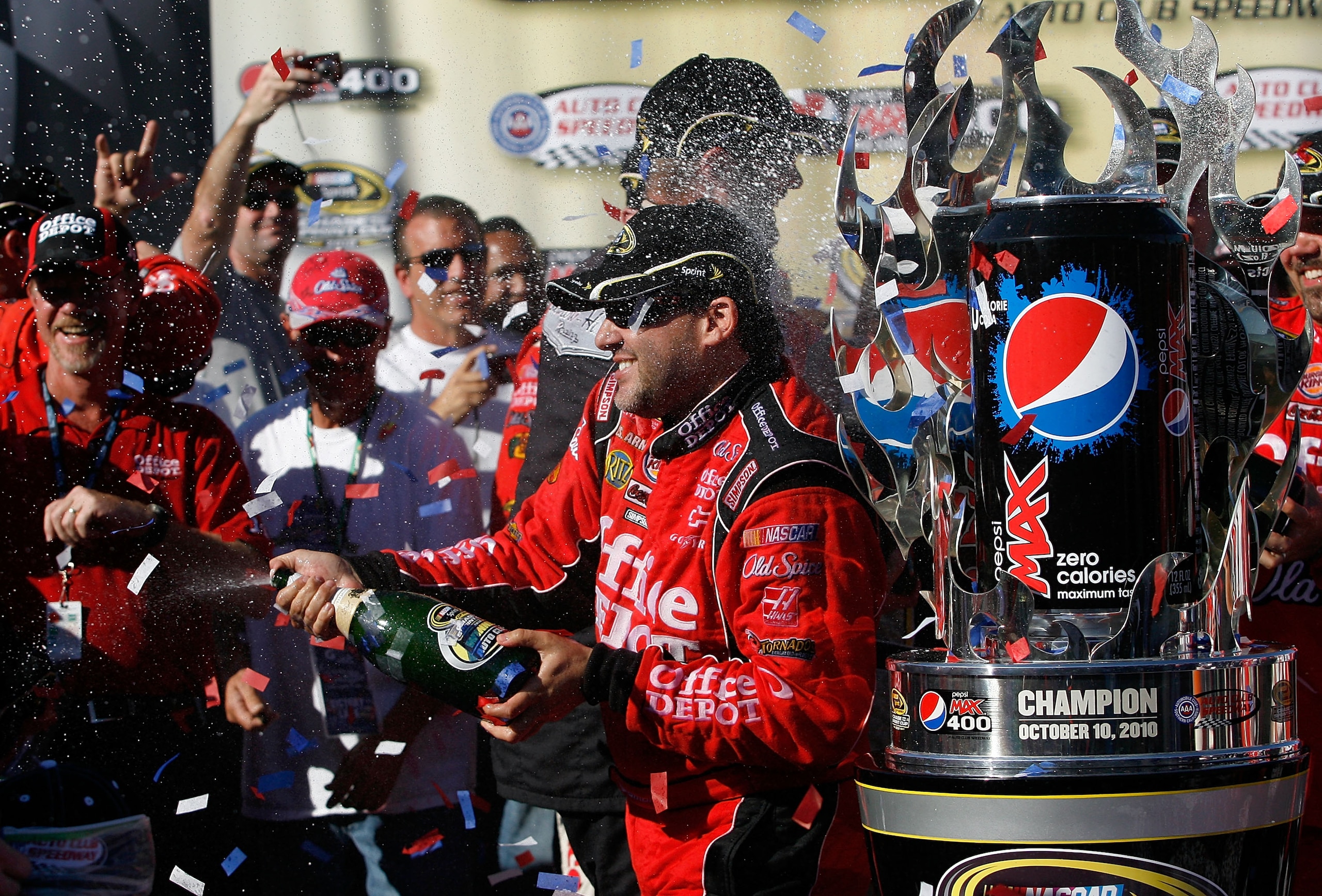 FONTANA, CA - OCTOBER 10: Tony Stewart (R), driver of the #14 Office Depot Chevrolet, celebrates in victory lane after winning the NASCAR Sprint Cup Series Pepsi Max 400 on October 10, 2010 in Fontana, California. (Photo by Tom Pennington/Getty Images f FONTANA, CA - OCTOBER 10: Tony Stewart (R), driver of the #14 Office Depot Chevrolet, celebrates in victory lane after winning the NASCAR Sprint Cup Series Pepsi Max 400 on October 10, 2010 in Fontana, California. (Photo by Tom Pennington/Getty Images f
