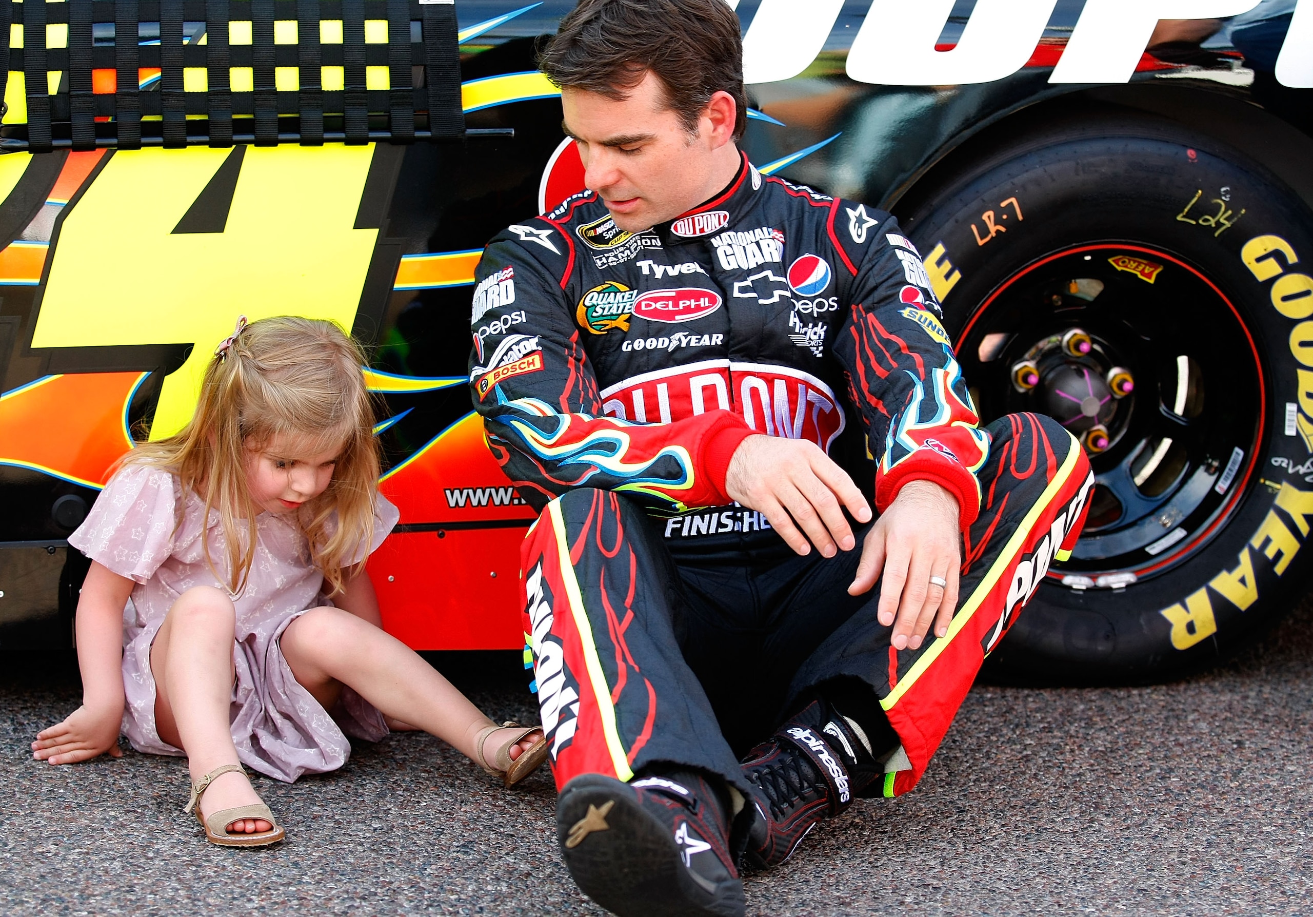 PHOENIX - APRIL 10: Jeff Gordon, driver of the #24 DuPont Chevrolet, sits with daughter Ella Sophia Gordon prior to the NASCAR Sprint Cup Series SUBWAY Fresh Fit 600 at Phoenix International Raceway on April 10, 2010 in Phoenix, Arizona. (Photo by Geoff PHOENIX - APRIL 10: Jeff Gordon, driver of the #24 DuPont Chevrolet, sits with daughter Ella Sophia Gordon prior to the NASCAR Sprint Cup Series SUBWAY Fresh Fit 600 at Phoenix International Raceway on April 10, 2010 in Phoenix, Arizona. (Photo by Geoff