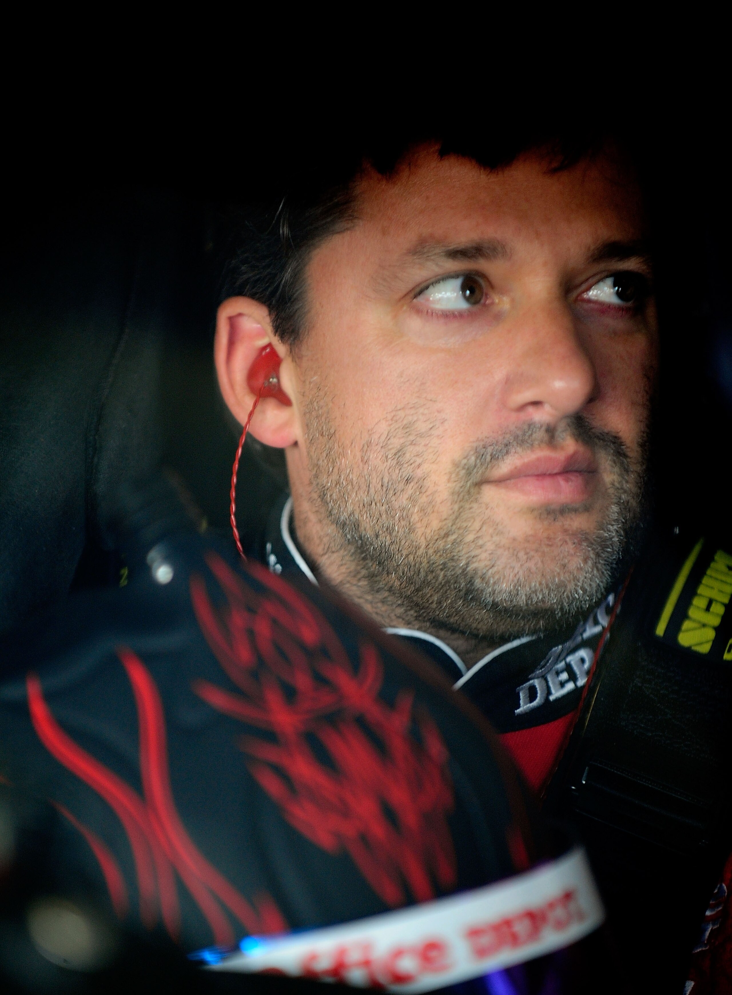 HOMESTEAD, FL - NOVEMBER 20: Tony Stewart, driver of the #14 Old Spice/Office Depot Chevrolet, sits in his car during practice for the NASCAR Sprint Cup Series Ford 400 at Homestead-Miami Speedway on November 20, 2010 in Homestead, Florida. (Photo by Ru HOMESTEAD, FL - NOVEMBER 20: Tony Stewart, driver of the #14 Old Spice/Office Depot Chevrolet, sits in his car during practice for the NASCAR Sprint Cup Series Ford 400 at Homestead-Miami Speedway on November 20, 2010 in Homestead, Florida. (Photo by Ru