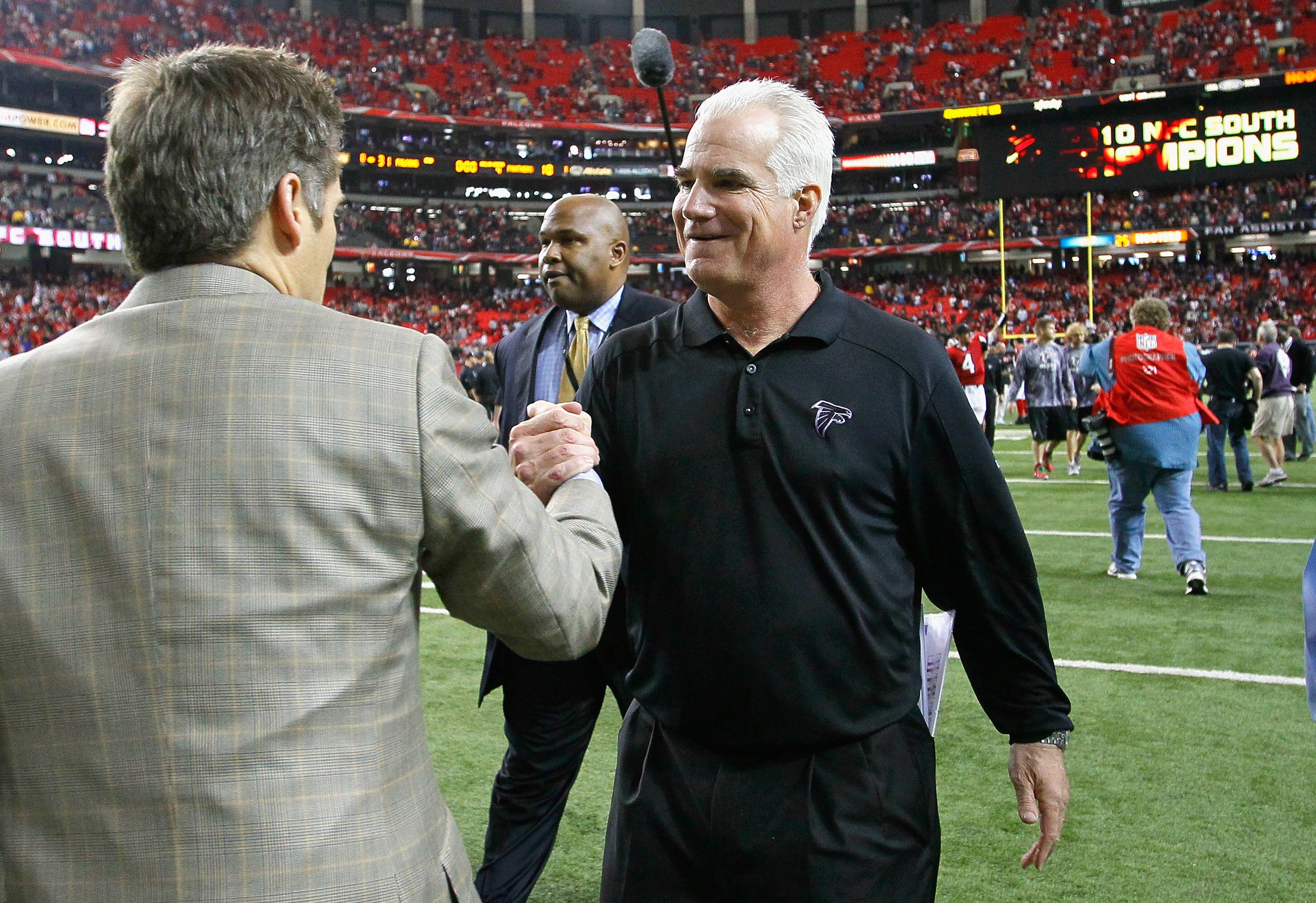 ATLANTA, GA - JANUARY 02:  Head coach Mike Smith and General Manager Thomas Dimitrof of the Atlanta Falcons celebrate after their 31-10 win over the Carolina Panthers at Georgia Dome on January 2, 2011 in Atlanta, Georgia.  (Photo by Kevin C. Cox/Getty Im