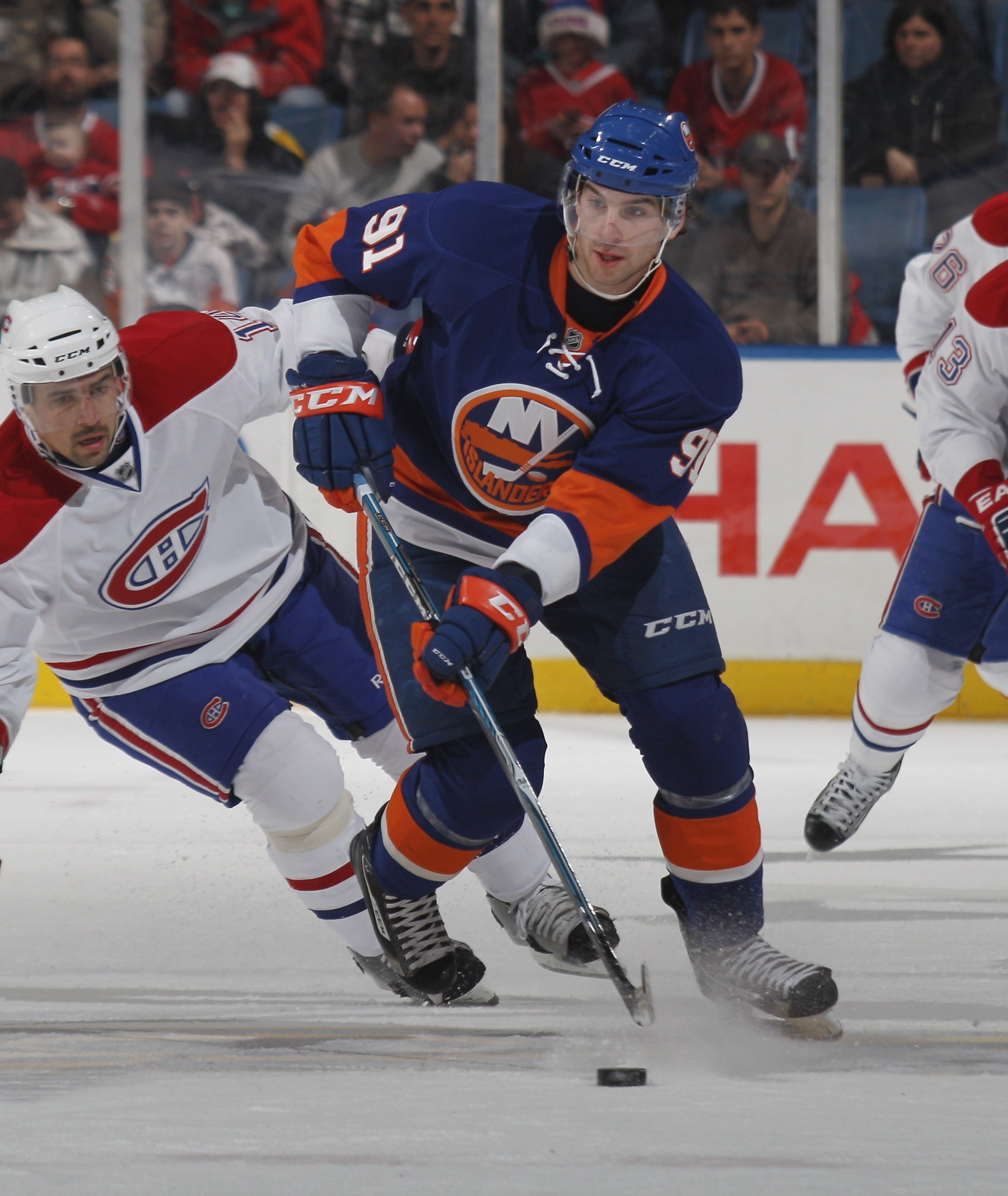 UNIONDALE, NY - DECEMBER 26:  John Tavares #91 of the New York Islanders skates against the Montreal Canadiens at the Nassau Coliseum on December 26, 2010 in Uniondale, New York. The Islanders defeated the Canadiens 4-1.  (Photo by Bruce Bennett/Getty Ima