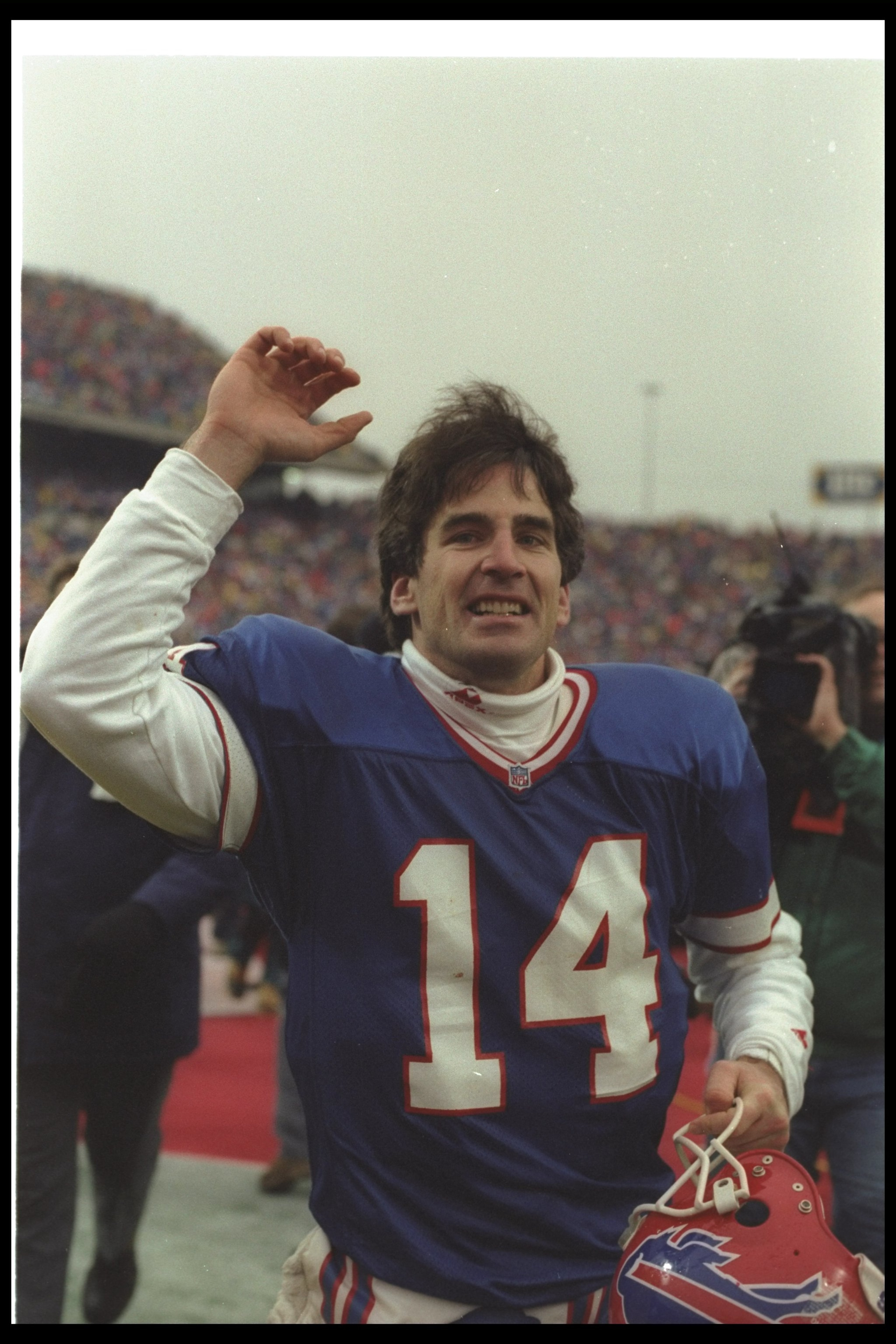 3 Jan 1993: Quarterback Frank Reich of the Buffalo Bills celebrates after a playoff game against the Houston Oilers at Rich Stadium in Orchard Park, New York. The Bills won the game in overtime, 41-38.