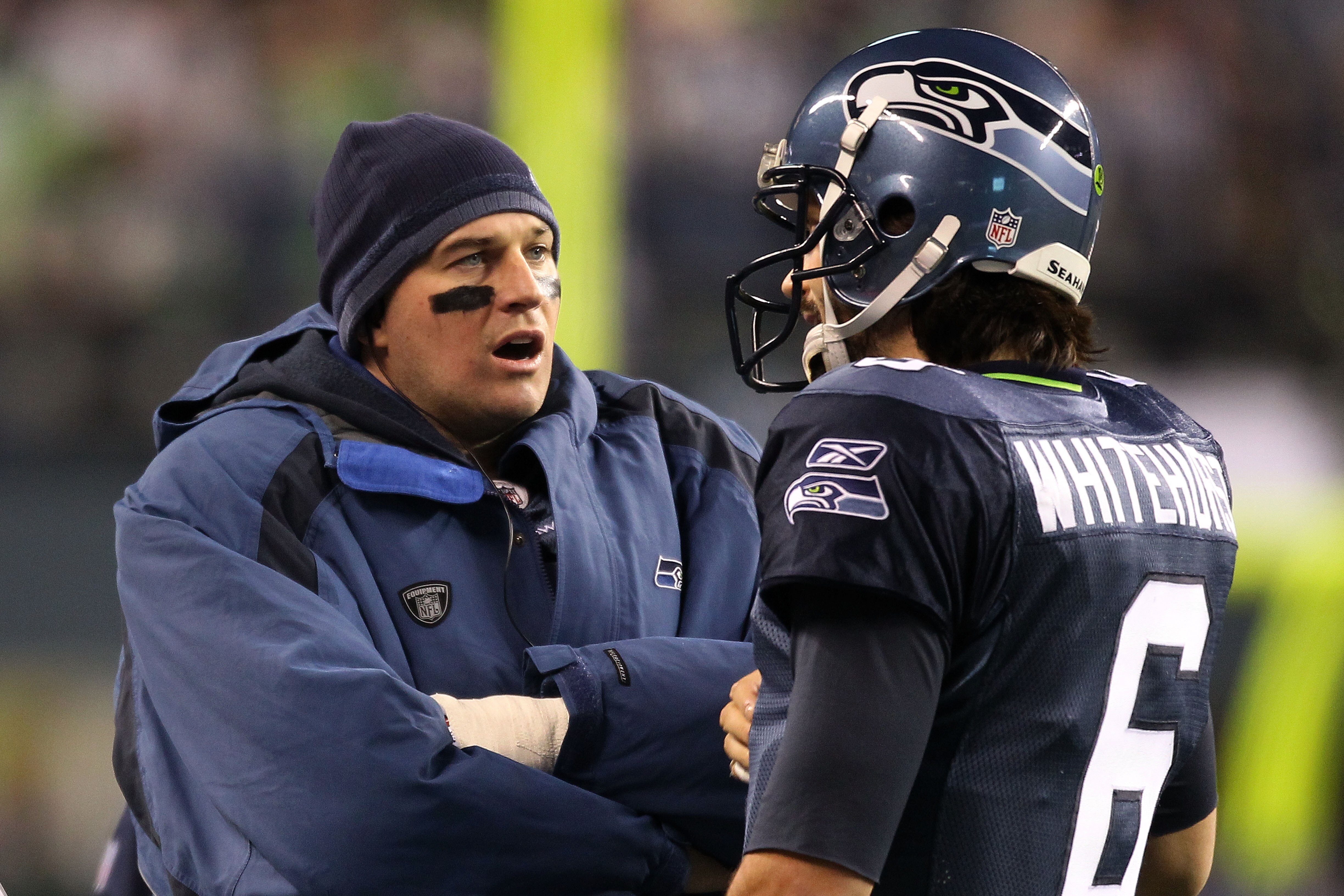 SEATTLE, WA - JANUARY 02:  (L-R) Quarterbacks Matt Hasselbeck #8 and Charlie Whitehurst #6 of the Seattle Seahawks speak on the sidelines during their game against the St. Louis Rams at Qwest Field on January 2, 2011 in Seattle, Washington.  (Photo by Ott