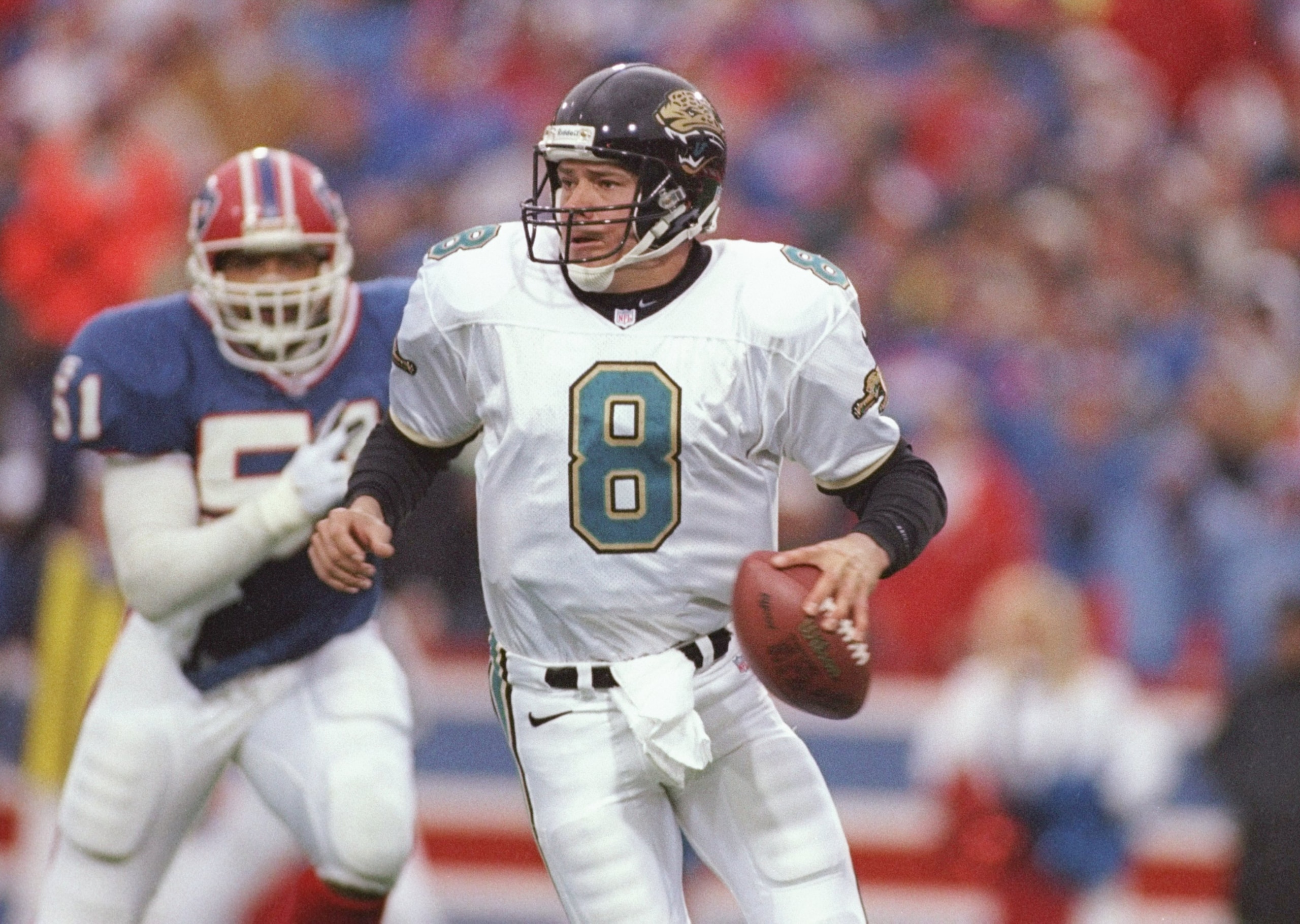 28 Dec 1996:  Quarterback Mark Brunell of the Jacksonville Jaguars scrambles out of the pocket during the Jaguars 30-27 AFC Playoff win over the Buffalo Bills at Rich Stadium in Orchard Park, New York. Mandatory Credit: Rick Stewart  /Allsport
