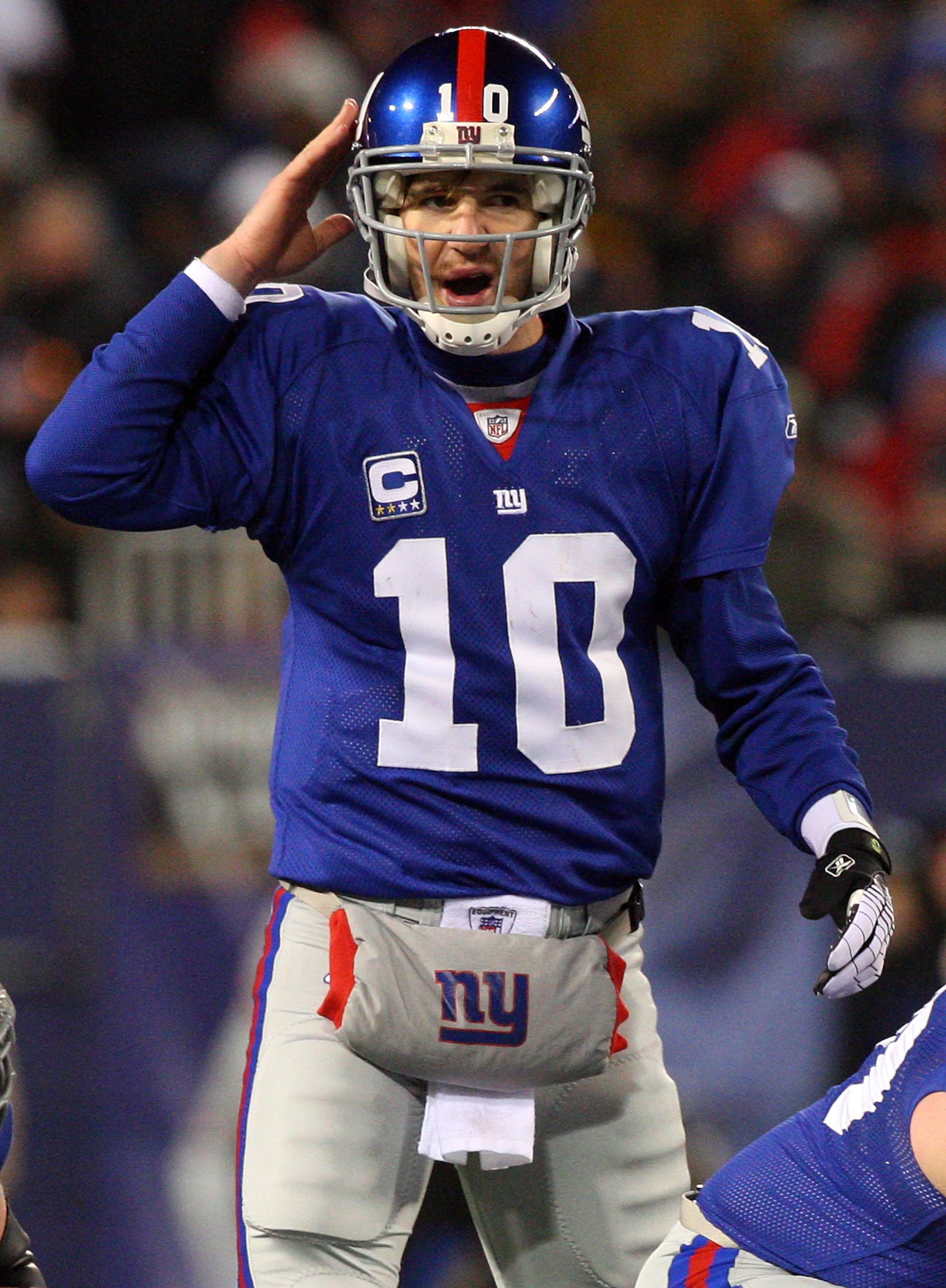 EAST RUTHERFORD, NJ - DECEMBER 21:  Eli Manning #10 of the New York Giants looks on against the Carolina Panthers on December 21, 2008 at Giants Stadium in East Rutherford, New Jersey.  (Photo by Jim McIsaac/Getty Images)