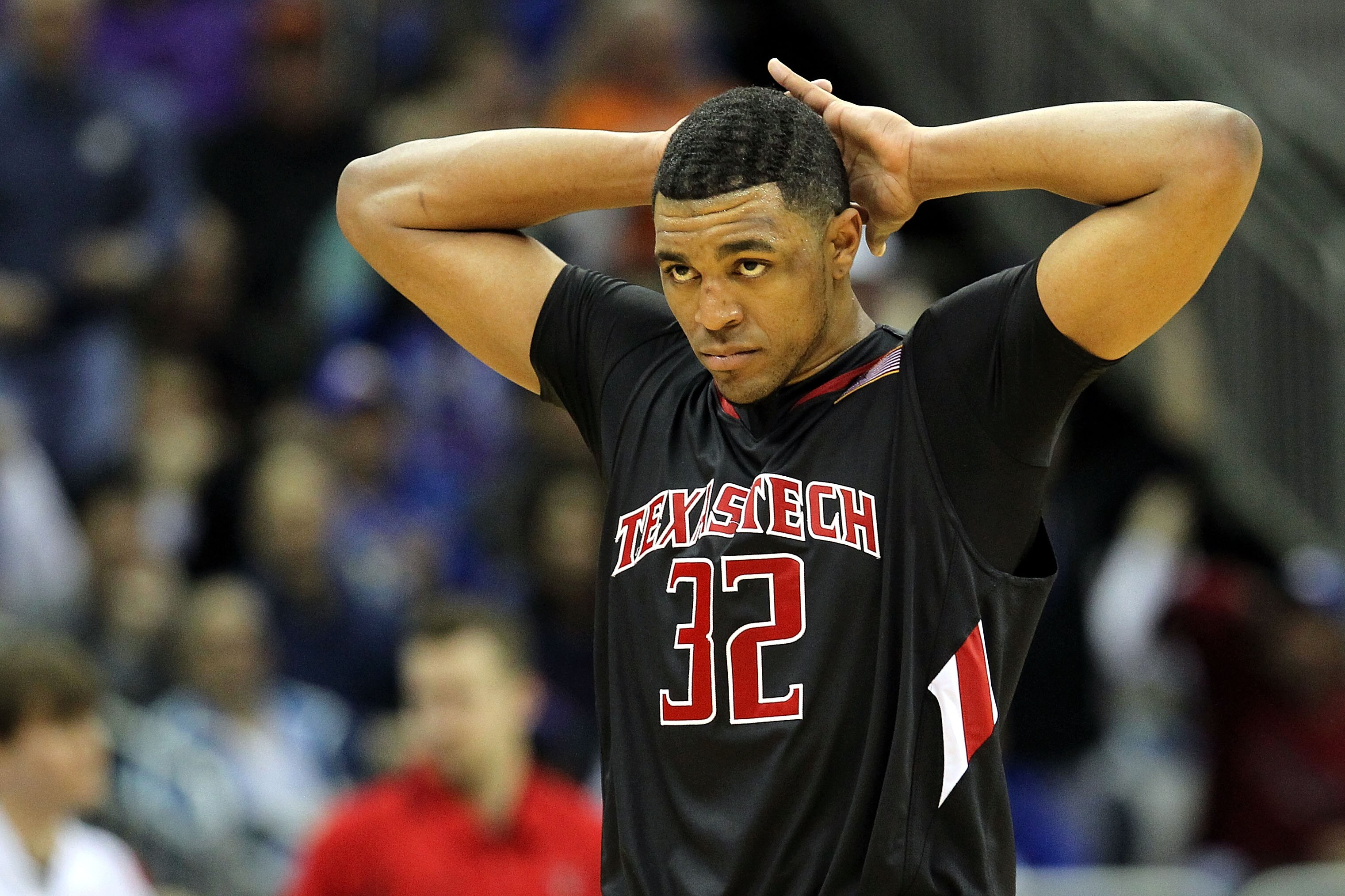 KANSAS CITY, MO - MARCH 11:  Mike Singletary #32 of the Texas Tech Red Raiders reatcs in the second half while taking on the Kansas Jayhawks during the quarterfinals of the 2010 Phillips 66 Big 12 Men's Basketball Tournament at the Sprint Center on March