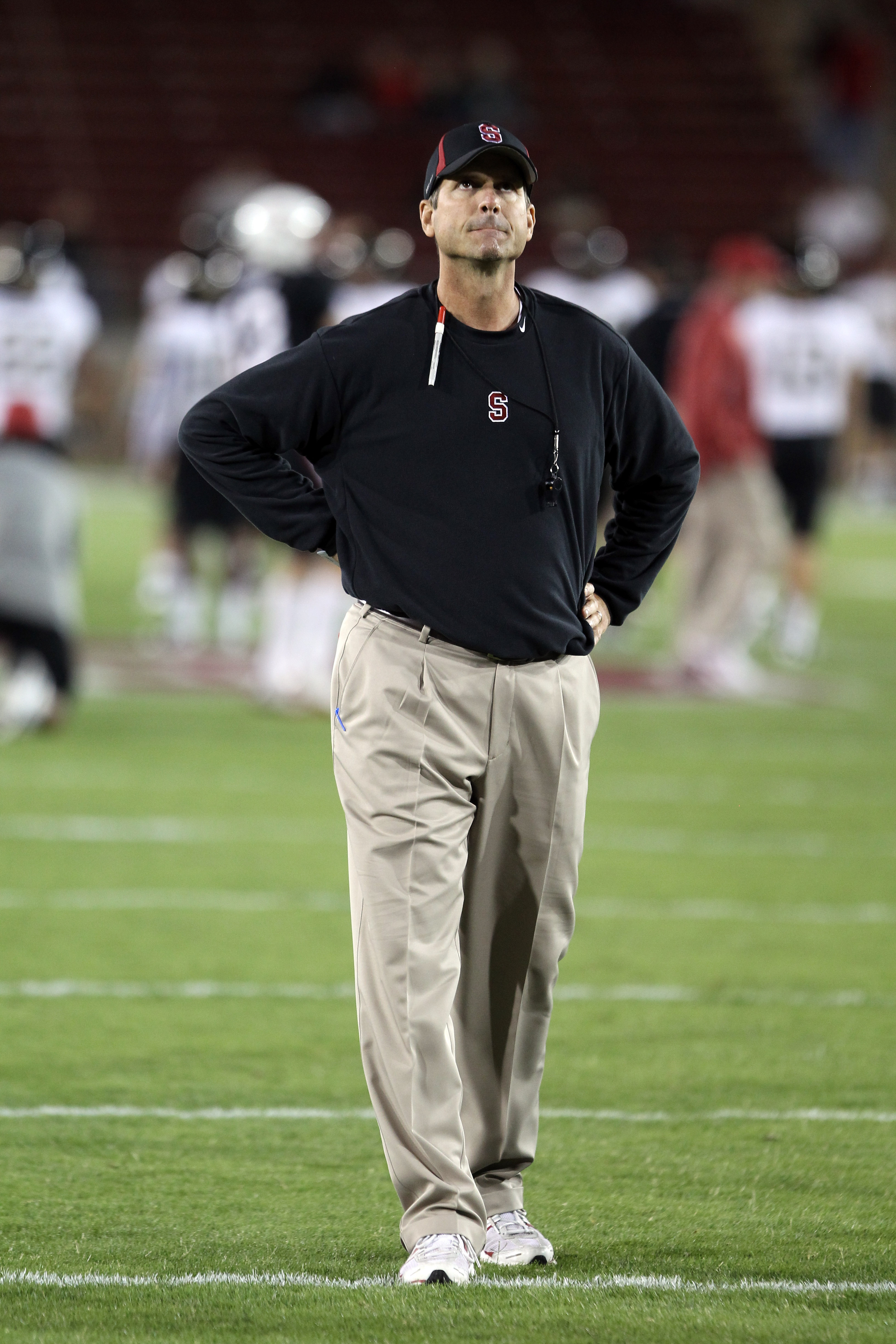 PALO ALTO, CA - SEPTEMBER 18:  Head coach Jim Harbaugh of the Stanford Cardinal watches his team warm up before their game against the Wake Forest Demon Deacons at Stanford Stadium on September 18, 2010 in Palo Alto, California.  (Photo by Ezra Shaw/Getty
