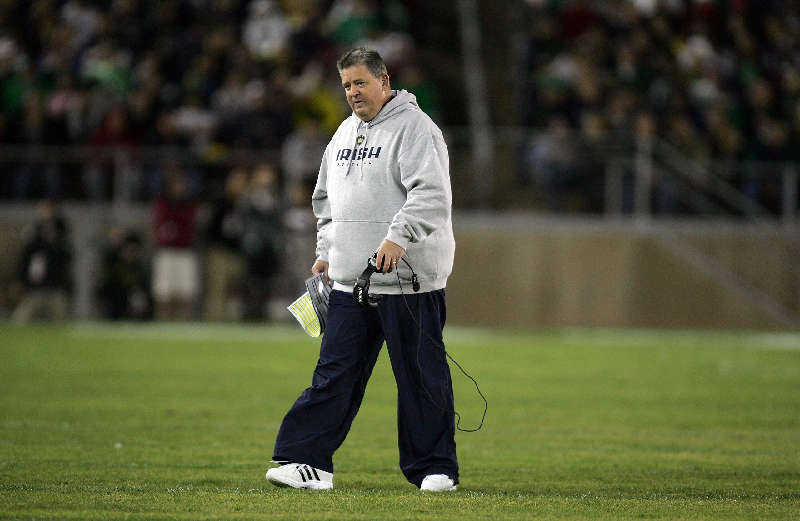 PALO ALTO, CA - NOVEMBER 28: Notre Dame head coach Charlie Weis walks back to the sideline after speaking to his team during their game against the Stanford Cardinal at Stanford Stadium on November 28, 2009 in Palo Alto, California. (Photo by Ezra Shaw/ PALO ALTO, CA - NOVEMBER 28: Notre Dame head coach Charlie Weis walks back to the sideline after speaking to his team during their game against the Stanford Cardinal at Stanford Stadium on November 28, 2009 in Palo Alto, California. (Photo by Ezra Shaw/
