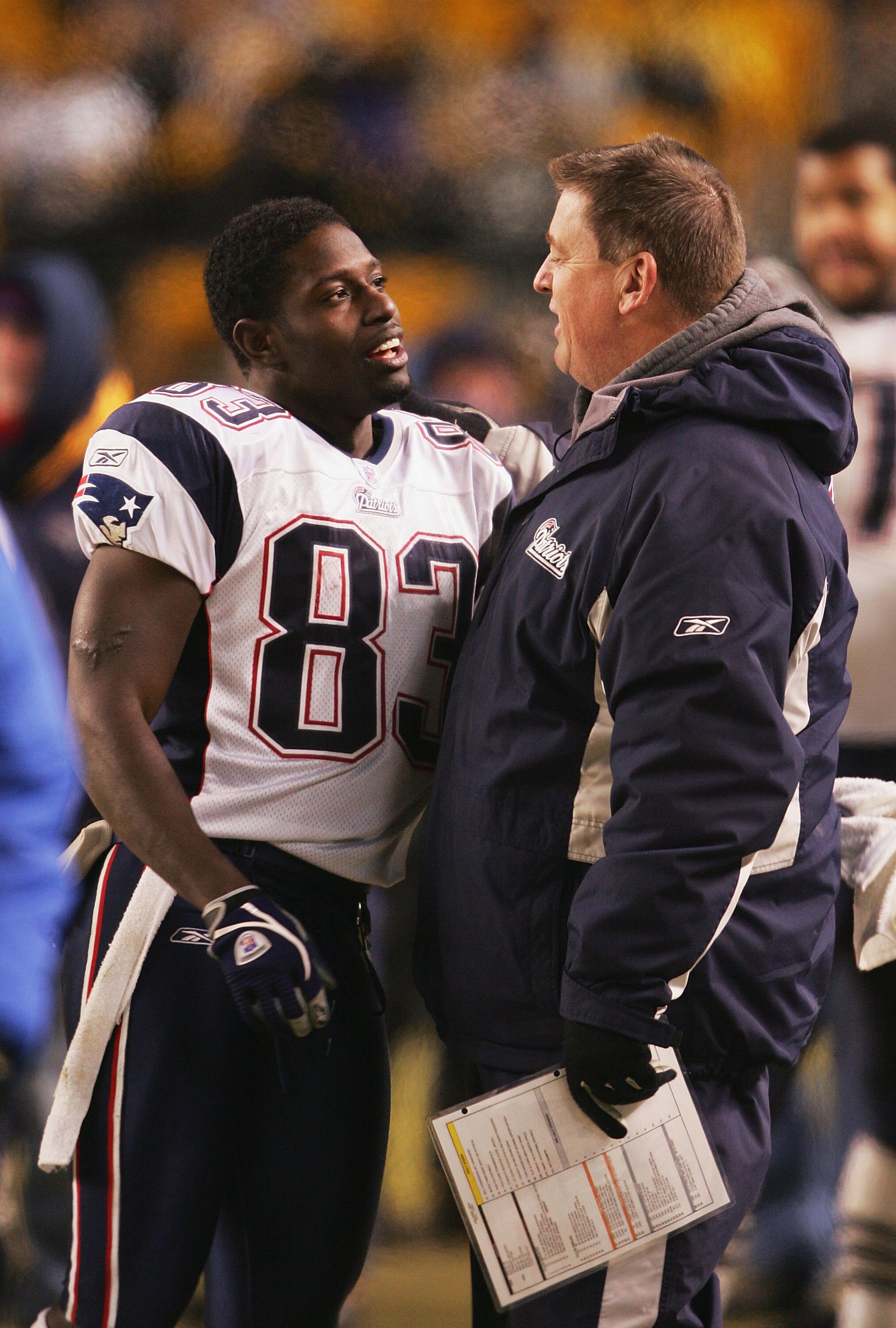 PITTSBURGH - JANUARY 23:  Wide receiver Deion Branch #83 of the New England Patriots is congratulated by offensive coordinator Charlie Weis after defeating the Pittsburgh Steelers in the AFC championship game at Heinz Field on January 23, 2005 in Pittsbur