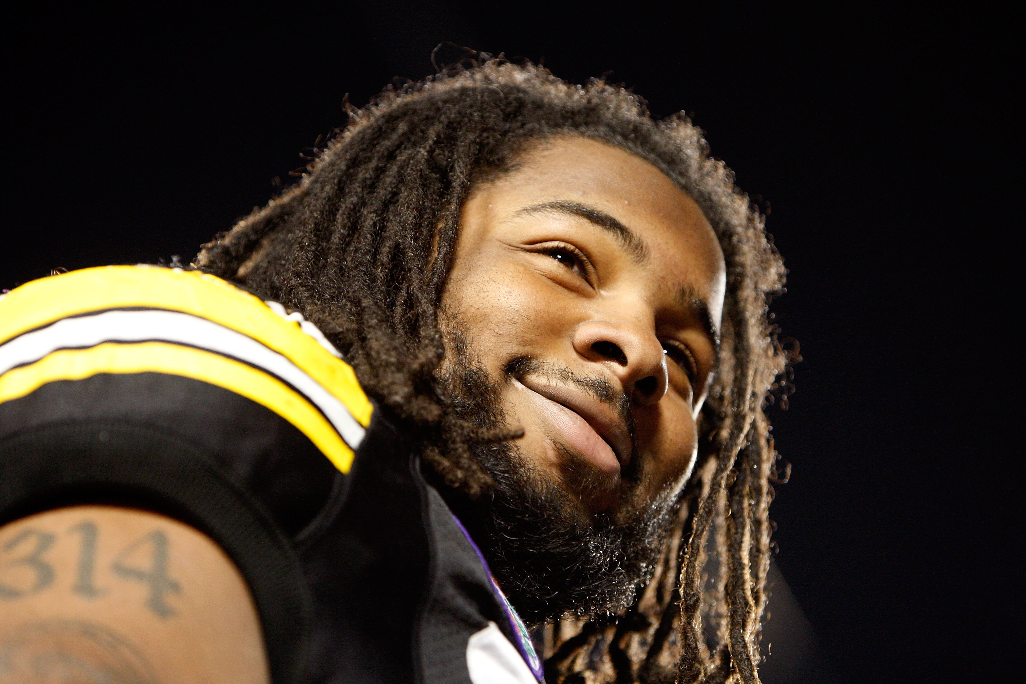 MIAMI GARDENS, FL - JANUARY 05:  Adrian Clayborn #94 of the Iowa Hawkeyes looks on as the Hawkeyes celebrate their 24-14 win against the Georgia Tech Yellow Jackets during the FedEx Orange Bowl at Land Shark Stadium on January 5, 2010 in Miami Gardens, Fl