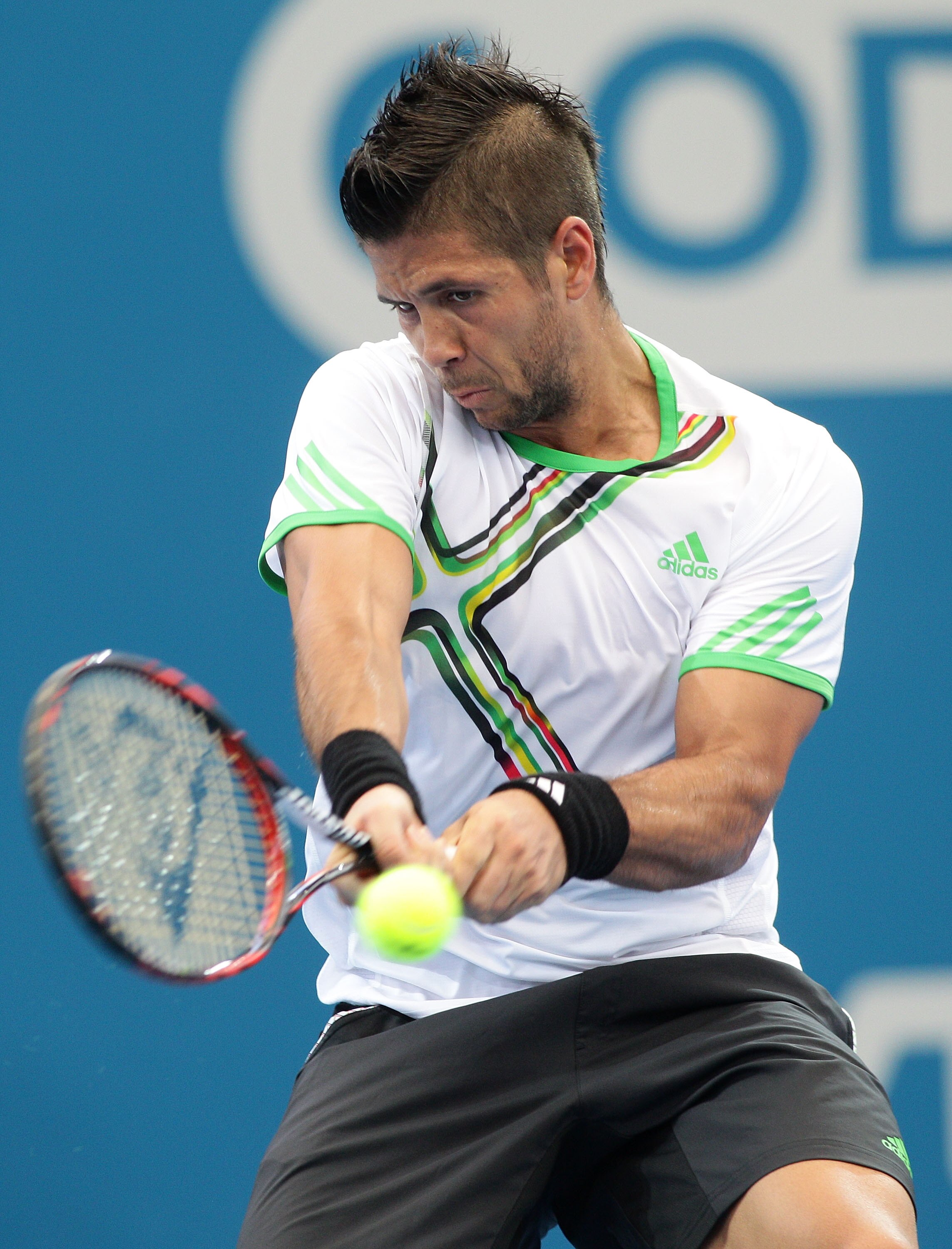 BRISBANE, AUSTRALIA - JANUARY 04:  Fernando Verdasco of Spain plays a backhand during his first round match against Benjamin Becker of Germany during day three of the Brisbane International at the Queensland Tennis Centre on January 4, 2011 in Brisbane, A