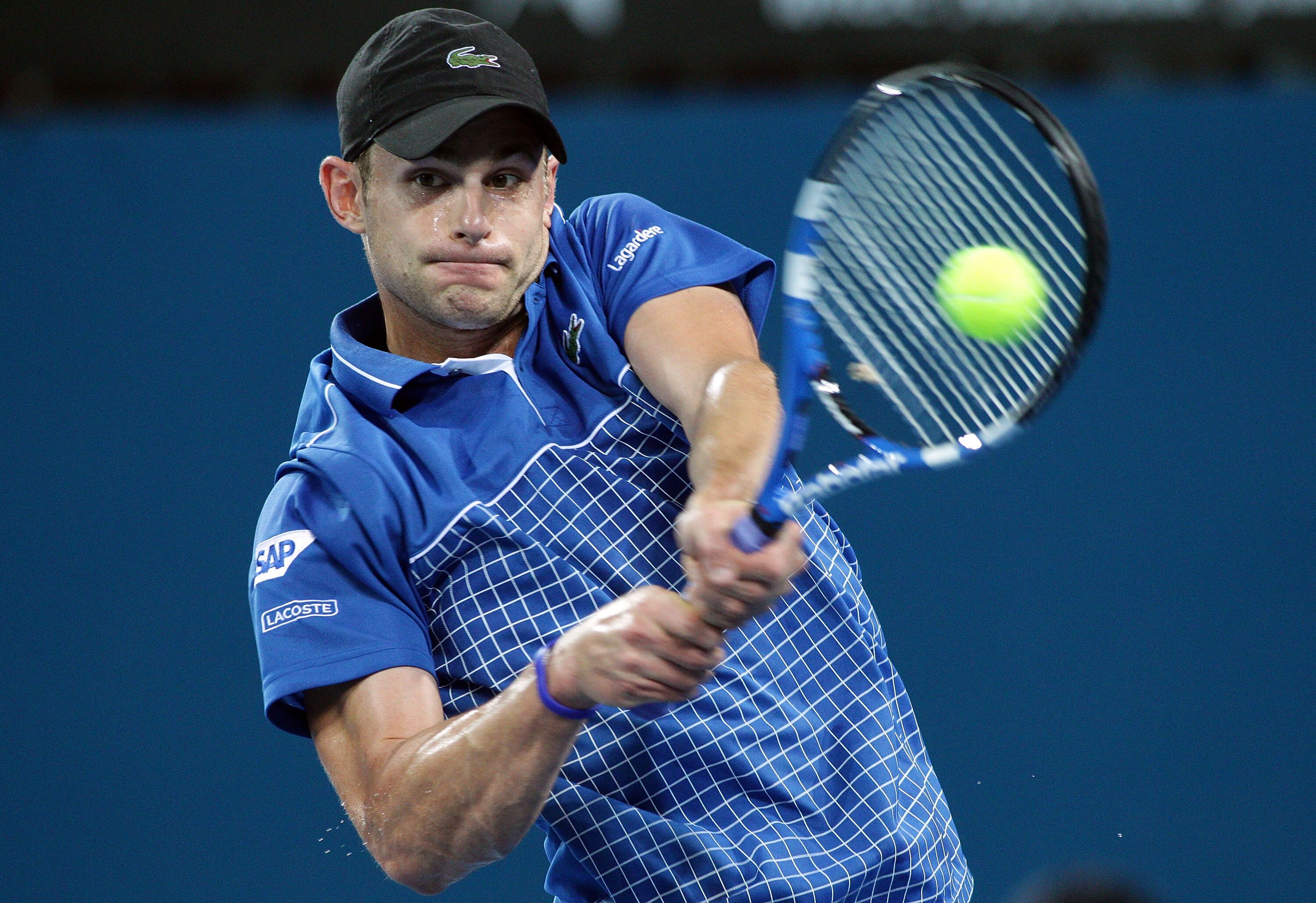 BRISBANE, AUSTRALIA - JANUARY 03:  Andy Roddick of the USA plays a backhand during his first round match against Marinko Matosevic of Australia during day two of the Brisbane International at Queensland Tennis Centre on January 3, 2011 in Brisbane, Austra