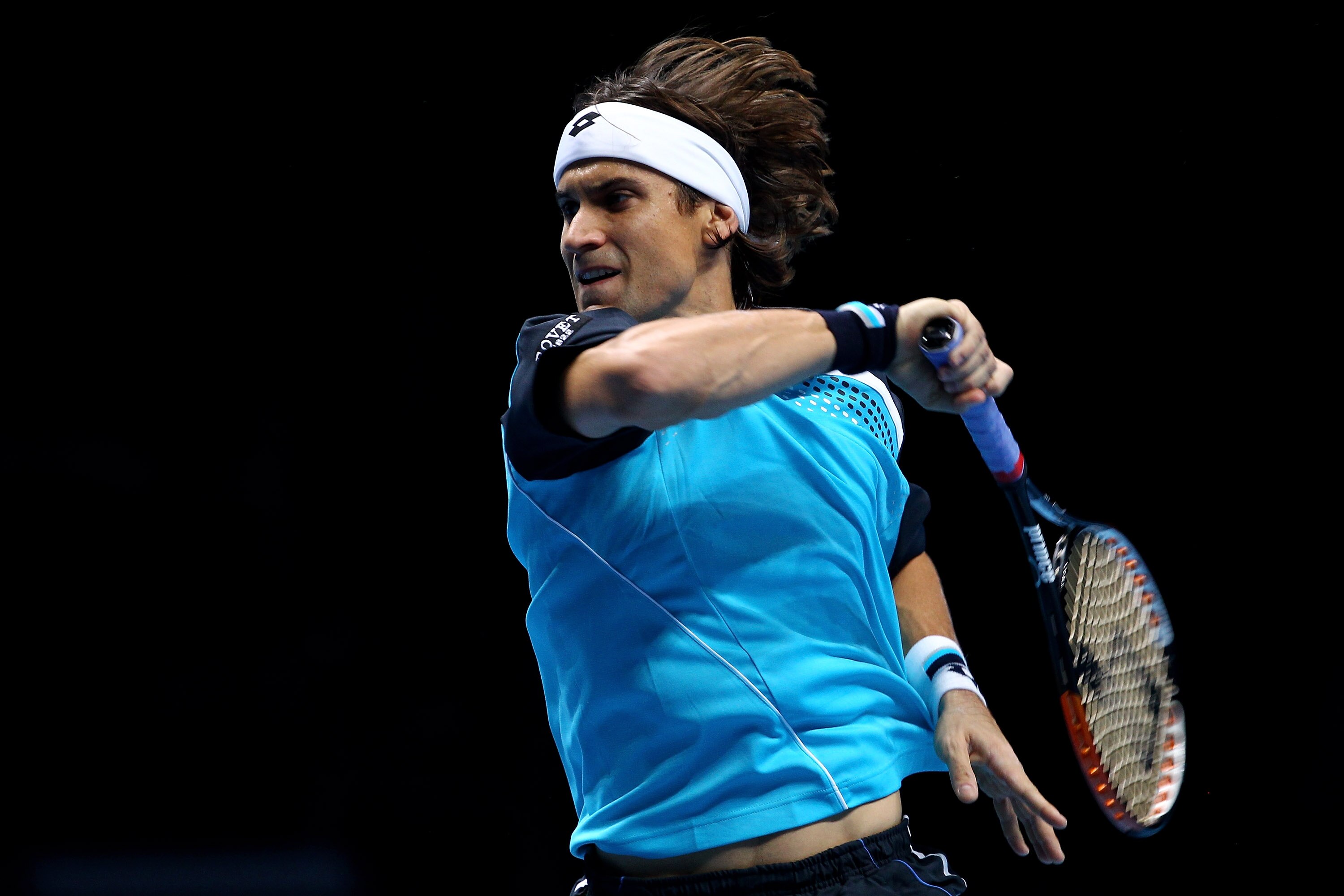 LONDON, ENGLAND - NOVEMBER 25:  David Ferrer of Spain returns the ball during his men's singles match against Andy Murray of Great Britain during ATP World Tour Finals at O2 Arena on November 25, 2010 in London, England.  (Photo by Julian Finney/Getty Ima