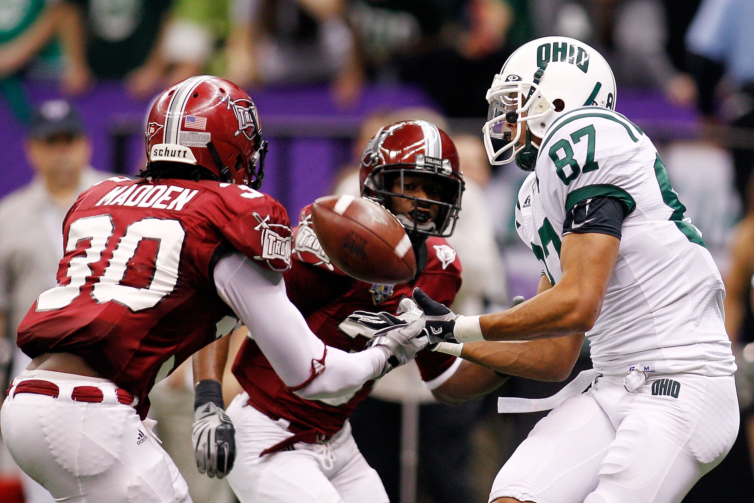 NEW ORLEANS, LA - DECEMBER 18: Steven Goulet #87 of the Ohio University Bobcats catches a touchdown pass over Ladarrius Madden #30 of the Troy University Trojans during the R&L Carriers New Orleans Bowl at the Louisiana Superdome on December 18, 2010 in NEW ORLEANS, LA - DECEMBER 18: Steven Goulet #87 of the Ohio University Bobcats catches a touchdown pass over Ladarrius Madden #30 of the Troy University Trojans during the R&L Carriers New Orleans Bowl at the Louisiana Superdome on December 18, 2010 in