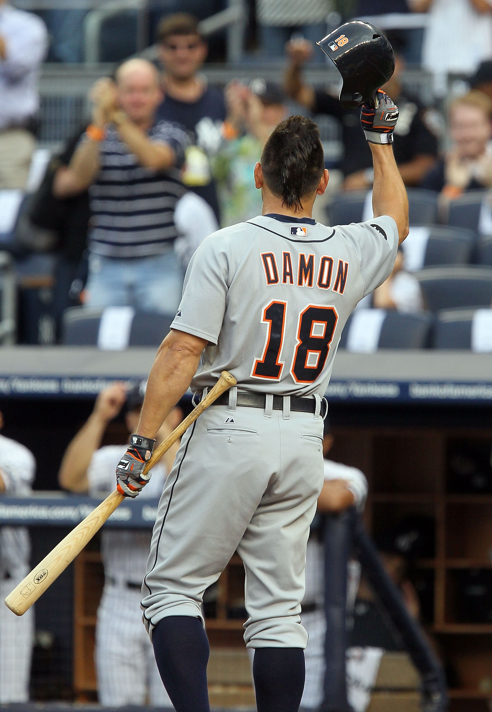 NEW YORK - AUGUST 16:  Johnny Damon #18 of the Detroit Tigers salutes the crowd prior to his first at bat against the New York Yankees on August 16, 2010 at Yankee Stadium in the Bronx borough of New York City.  (Photo by Jim McIsaac/Getty Images)