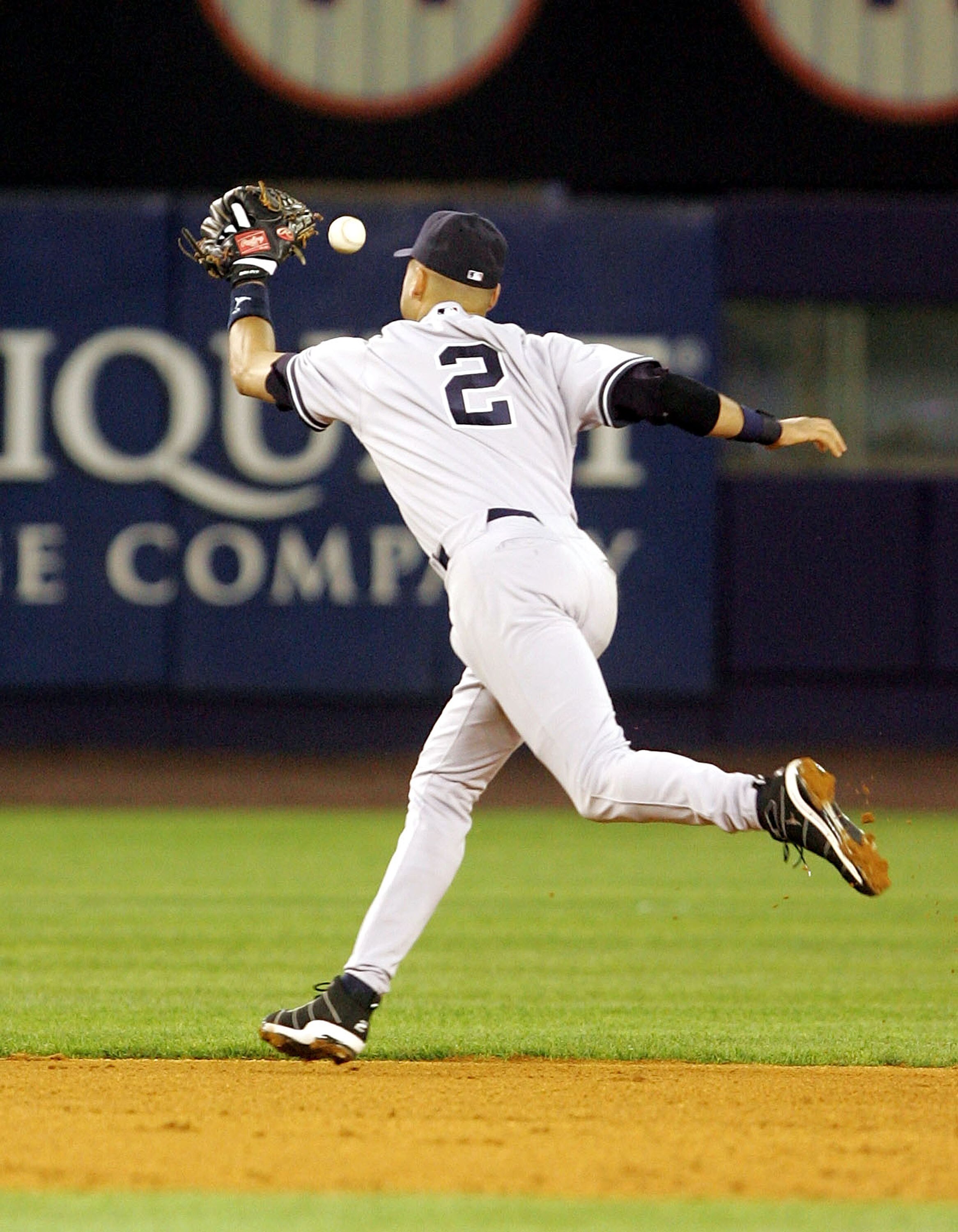 NEW YORK - MAY 20:  Derek Jeter #2 of the New York Yankees commits a fielding error in the sixth inning against the New York Mets at Shea Stadium on May 20, 2005 in the Flushing neighborhood of New York City.  (Photo by Jim McIsaac/Getty Images)