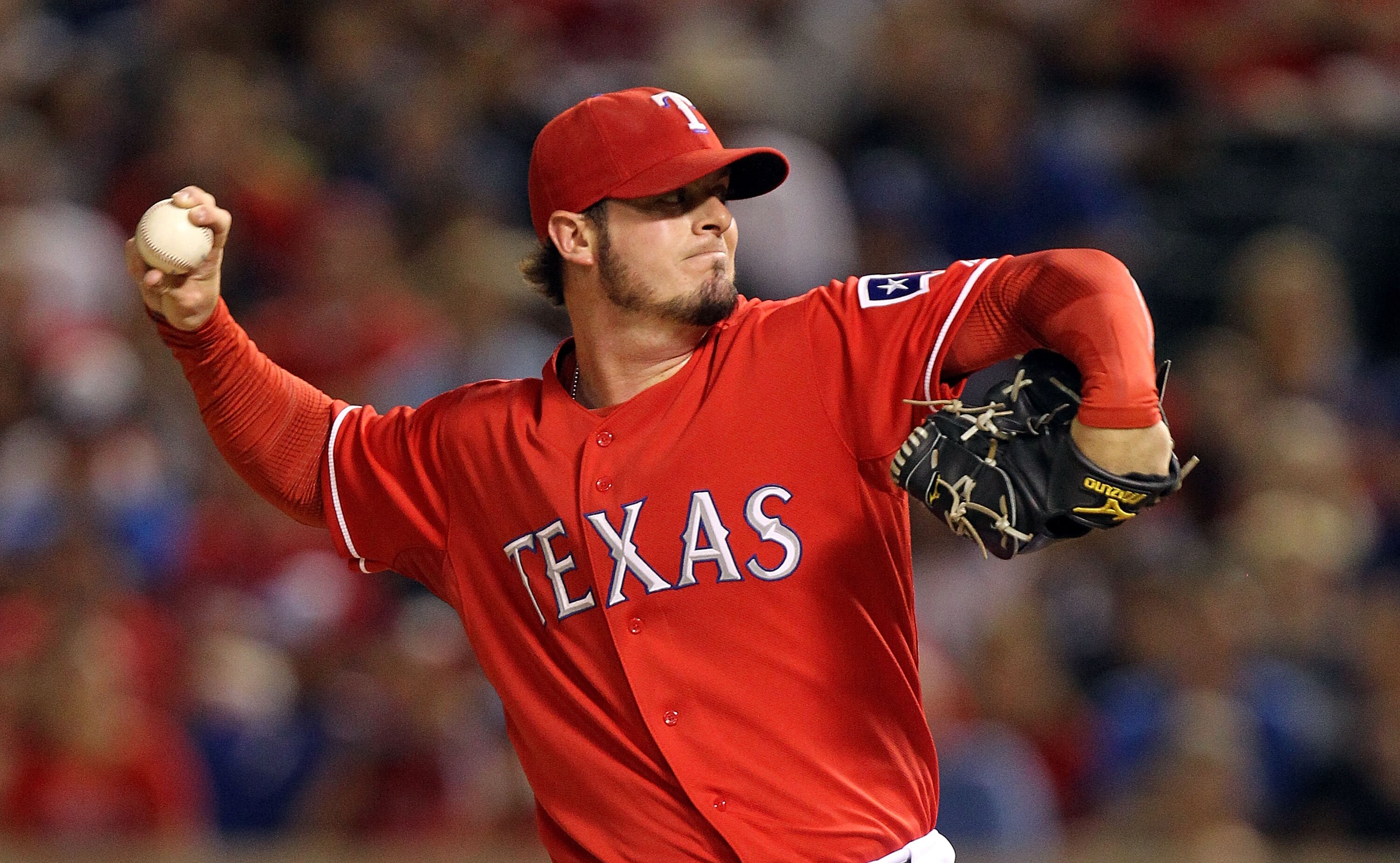 ARLINGTON, TX - OCTOBER 01:  Pitcher Mark Lowe #49 of the Texas Rangers thows against the Los Angeles Angels of Anaheim at Rangers Ballpark in Arlington on October 1, 2010 in Arlington, Texas.  (Photo by Ronald Martinez/Getty Images)