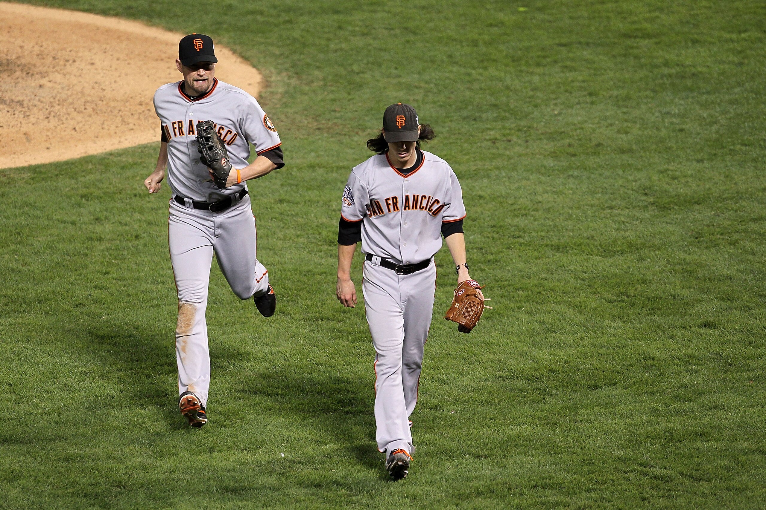 ARLINGTON, TX - NOVEMBER 01:  (L-R) Aubrey Huff #17 and Tim Lincecum #55 of the San Francisco Giants walks back to the dugout against the Texas Rangers in Game Five of the 2010 MLB World Series at Rangers Ballpark in Arlington on November 1, 2010 in Arlin