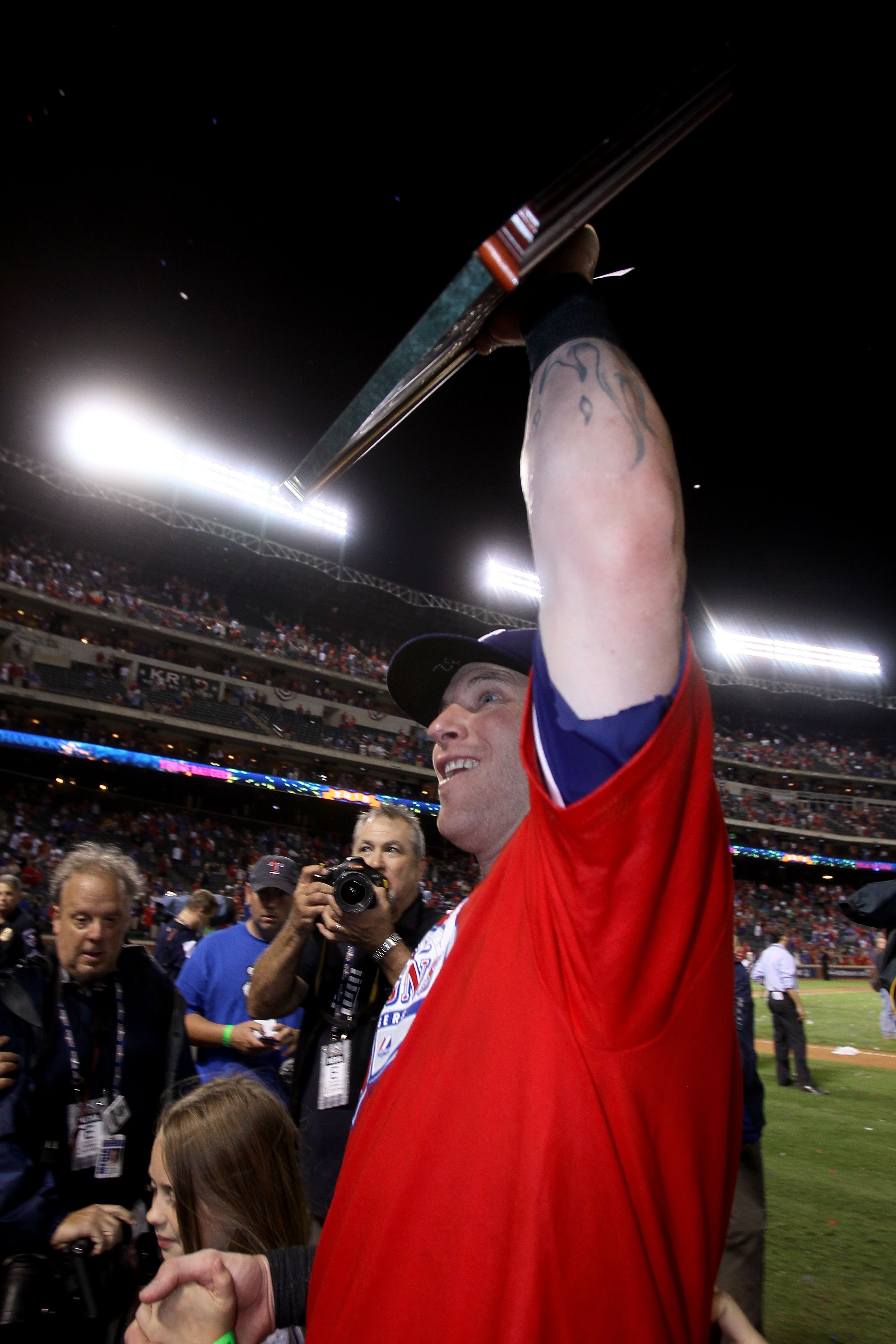 ARLINGTON, TX - OCTOBER 22:  Josh Hamilton #32 of the Texas Rangers celebrates with the AL championship series Most Valuable Player Award after defeating the New York Yankees 6-1 in Game Six of the ALCS to advance to the World Series during the 2010 MLB P