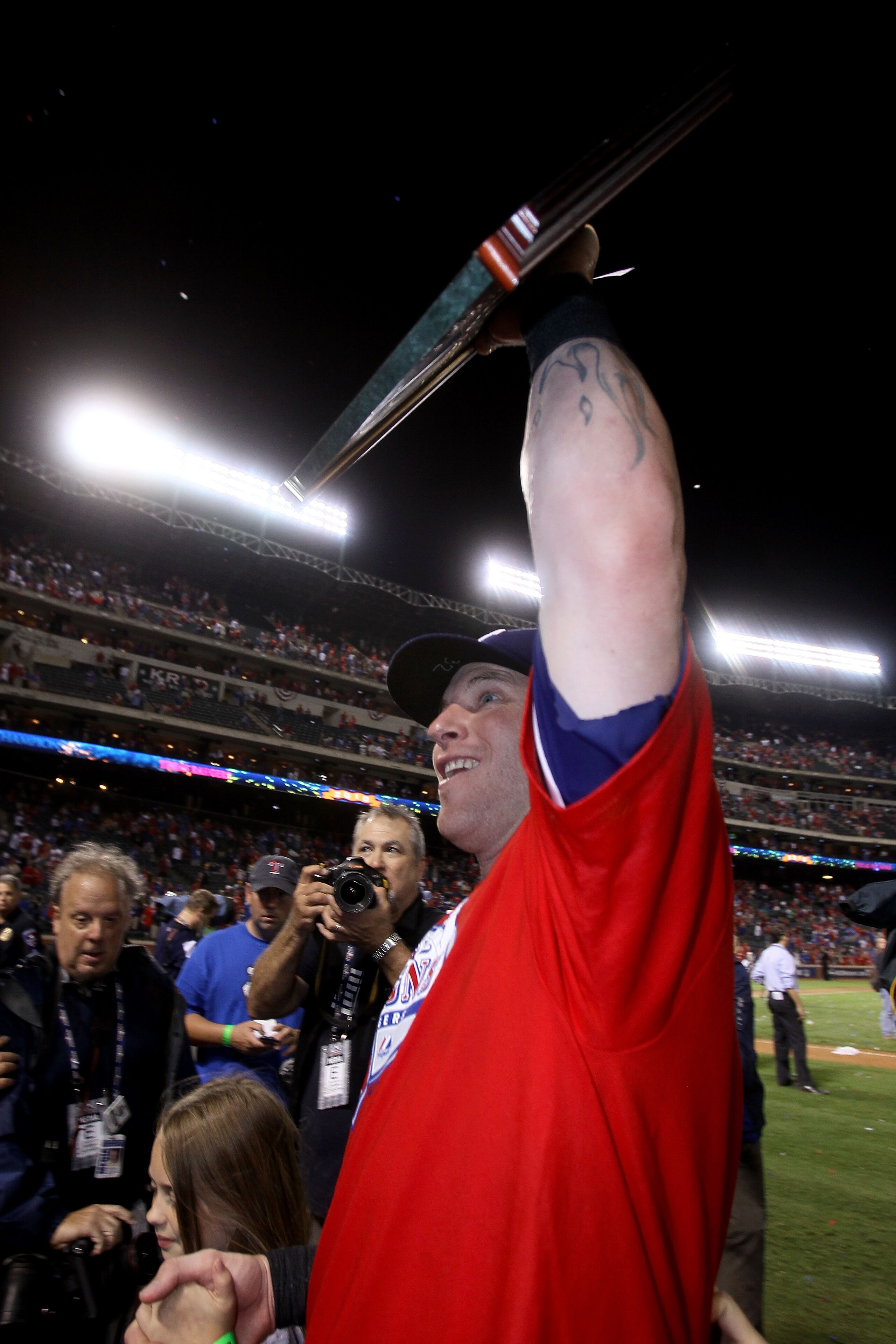 ARLINGTON, TX - OCTOBER 22:  Josh Hamilton #32 of the Texas Rangers celebrates with the AL championship series Most Valuable Player Award after defeating the New York Yankees 6-1 in Game Six of the ALCS to advance to the World Series during the 2010 MLB P